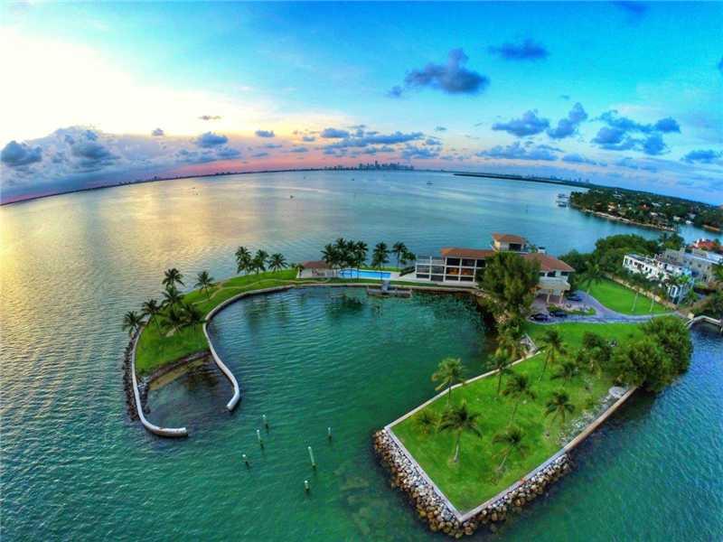 Greatest property  in South Florida - EVER. Captivating waterfront 2 acre gated grand estate on a private penninsula overlooking Biscayne Bay w/the Miami skyline as a backdrop.  2000 ft water frontage. 5 story 12000 sqft 6 bedrooms 8 full baths w/stunning  360 degree water & city views. Fabulous pool & gazebo area. Private deep water yacht harbor. Property was the playground of America's elite at the turn of the century. (Vanderbilt's, Carnegie's & the likes partied here).