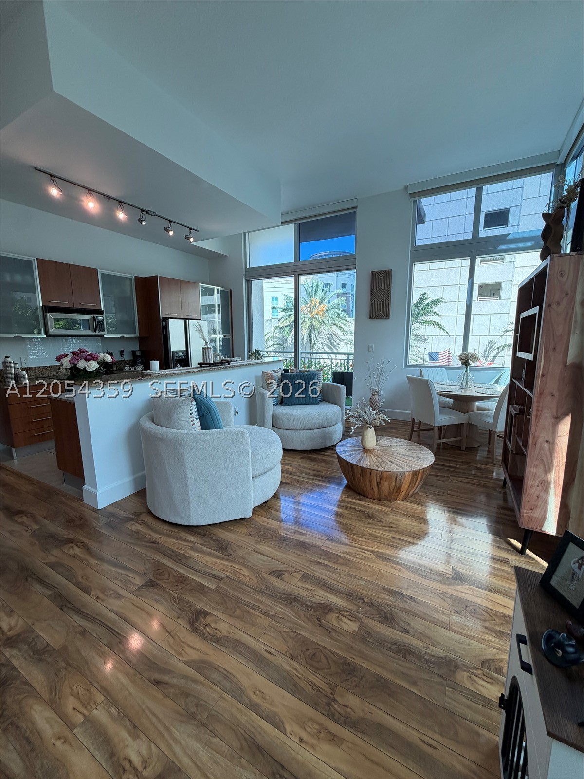 Experience luxury living in one of the most sought after 1 bedroom lofts at Metropolis at Dadeland. This stunning largest 1 bedroom + den residence welcomes you with dramatic 13' ceilings, creating an open, airy feel that is rarely available. 2 Floor to ceiling sliding doors and corner windows fill the home with natural light while showcasing serene private views of the lush landscaping. Enjoy seamless indoor-outdoor living with 2 private balconies, perfect for morning coffee. Spacious bedroom features an exeptionally large walk-in-closet, while the versatile den is ideal for an office or guest space. Kitchen offers abundant cabinetry with a generous pantry. Brand new washer & dryer. BUILDING OFFERS 2 HEATED POOLS, GYM, CARDIO ROON, POOL TABLE, 24 HOUR CONCIERGE & VALET. WALK TO DADELAND MALL, PUBLIX, TRADER JOES, METRO STATION AND ALL UP AND COMING RESTAURANTS.