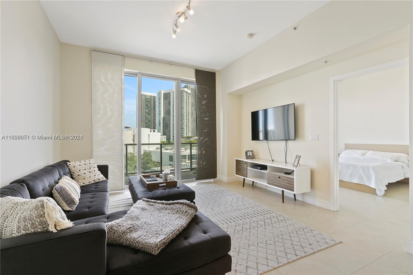 Step inside this beautiful bayfront unit in the heart of Midtown Miami. Floor-to-ceiling windows with a large glass balcony. The upscale building is located in the heart of the Midtown area, steps away from Miami Design District, Wynwood, and a few minutes from Miami Beach & South Beach. Excellent amenities and service include concierge service, pool area (3 deep pool, main pool, sauna, steam room, hot tub, and cabanas), club room, fireplace area, gym, and covered/gated park garage. The Midtown area offers many restaurants, bars, grocery stores, and retail stores within walking distance from the apartment.