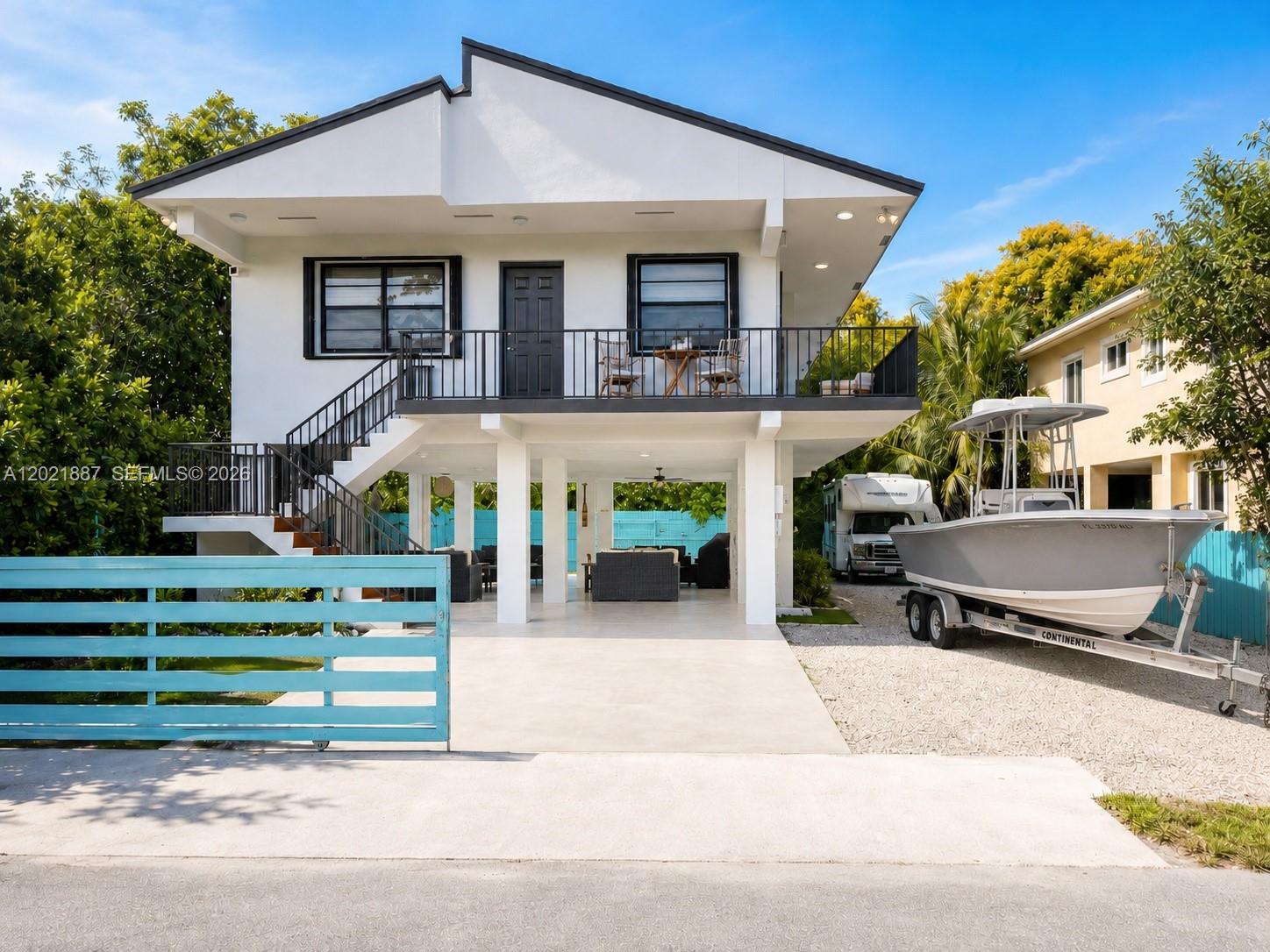 Ocean side location and solid CBS construction—two of the most desired features in the Florida Keys. This fully furnished 3/2 home is move-in ready and made to enjoy the coastal lifestyle from day one. The bright upstairs living area features remodeled bathrooms, fresh paint, new curtains, washer/dryer, balcony, and a comfortable Keys feel. The ground level offers new epoxy flooring, new fencing, an outdoor kitchen, outdoor shower, covered entertaining space, boat parking, and electric/plumbing connections for an RV. Minutes from Harry Harris Park, boat ramps, protected beach, Snappers Oceanfront Restaurant, markets, shops, restaurants, and great fishing spots. Approx. 1 hour from Miami and about 2.5 hours from Key West. Just arrive and start living the Keys. Sellers are looking for serious buyers. Property is currently tenant occupied. Showings will begin on June 16. To schedule a showing, please text the listing agent or co-listing agent. REALTORS PLEASE SEND OFFER WITH DU OR PROOF OF FUNDS.