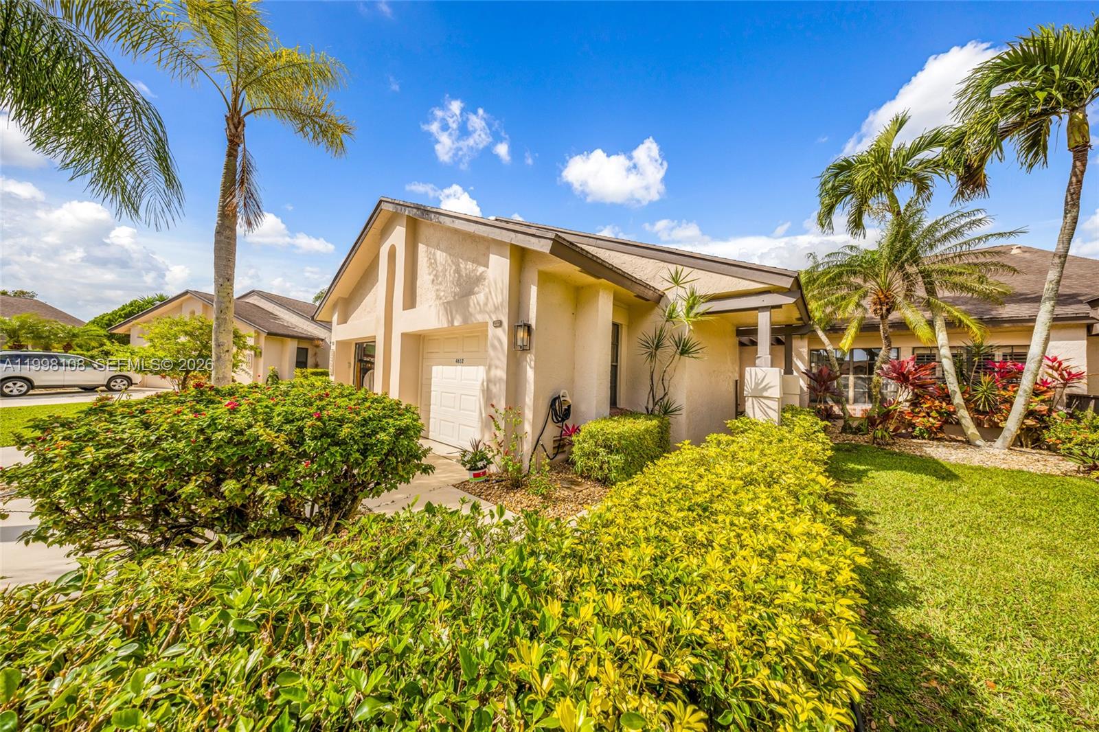 Beautiful 2BR/2BA + den villa with 1-car garage in Boca Delray Golf & Country Club, a 55+ gated community with no mandatory golf membership. This lakefront home features vaulted ceilings, fresh interior paint, and new recessed lighting. Tranquil lake and golf views from the back of this villa. The spacious private courtyard or patio are perfect spots for enjoying your morning coffee or afternoon cocktails. Brand new roof to be installed. GREAT LOCATION! Just minutes to the Newly Renovated Clubhouse. Community amenities include 24/7 manned gate, two heated pools, 5 tennis courts, and an 18-hole par-60 executive golf course with pay-as-you-play access. Active social calendar. HOA includes cable, building insurance, exterior maintenance/painting, pest control, cold water, roof maintenance, reserves, and trash removal. Close to shops, restaurants, major highways, and the beach.