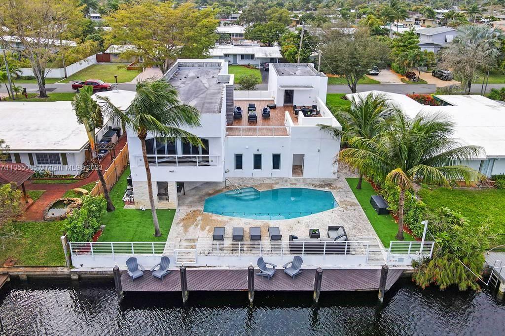 This stunning classic modern home boats 5 bedrooms + 1 room upstairs (6 in total), and 5 bathrooms. Modern furnishings throughout, tons of natural light, open floor plan, and beautiful waterway view makes this home a true showstopper. 
Gourmet Kitchen, Heated pool, No fix bridges, private entrance for Guest or Crew quarters. High Tech smart house, but user friendly.