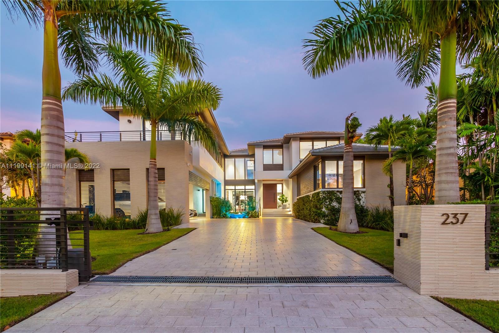 EXCLUSIVE BAL HARBOUR VILLAGE-GATED COMMUNITY. Spectacular 2018 Contemporary Gem! Beautifully designed 7 bedroom, 7 bath home with high end finishes--Marble & wide plank wood floors throughout, Mia Cucina Italian kitchen with Wolf & Subzero appliances, custom Italian doors throughout, Creston Smart System, plus much more! Great floor plan for family living and entertaining. 5 en-suite bedrooms plus loft, master with sitting area, spa like bathroom, rain shower & soaking tub, guest room/office and staff quarters. Tropical covered terrace with summer kitchen overlooks the lushly landscaped grounds & pool. Privacy gate and reflecting pool greet you as you enter this oasis.
