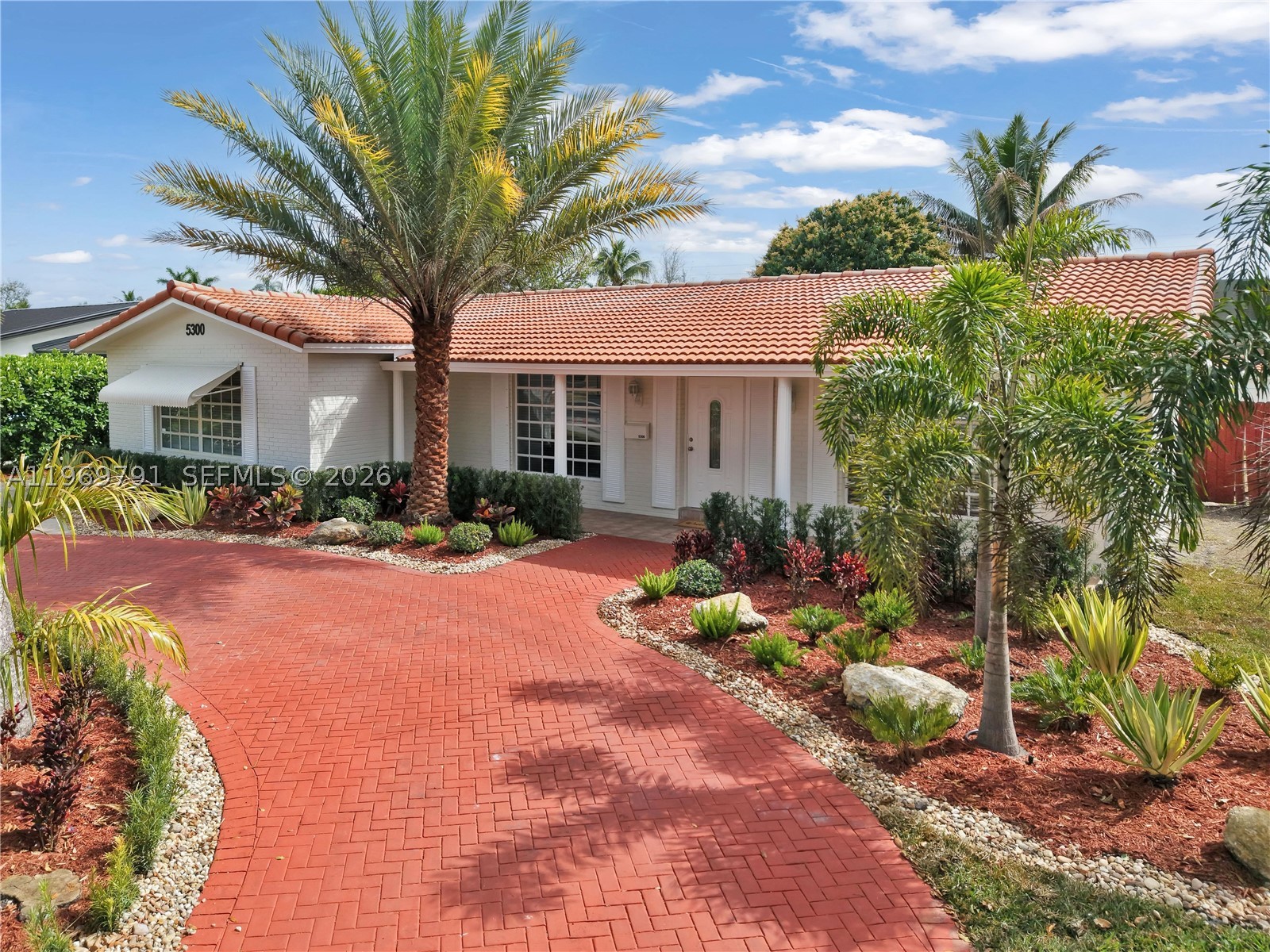 PRICE IMPROVEMENT! Renovated, 2898 square-foot, 6-bed, 3-bath home sits on a large 9,381 square foot lot and features a 4-bedroom, 2-bath main home plus a 2-bed,1-bath attached apartment with separate entrance. ideal for a multi-generational family or an income opportunity to live in the main home and rent out the apartment. Interior features and updates include: 2 fully renovated kitchens with glossy, white cabinetry, black and white granite countertops and backsplashes, brand-new appliances, separate laundry and AC's, recessed lighting, new baseboards, freshly painted interior and exterior, new electric panel, new AC system and new sprinkler system. Step outside to a large backyard with plenty of room to build your dream pool, entertain guests or create your own outdoor oasis. The 
newly landscaped front yard enhances curb appeal and value, while the circular driveway provides ample front parking plus additional parking in the rear. Located in the highly desired neighborhood of Hollywood Hills with easy access to Interstate 95 and Florida's Turnpike. One block from Nativity Church, Nativity Catholic School and  Chaminade-Madonna College Preparatory. Less than 1.5 miles to houses of worship and Memorial Regional and Joe DiMAggio's Children's Hospital. Close to Seminole Hard Rock Hotel & Casino and the famed Hollywood Beach and Broadwalk. This move-in-ready property offers space versatility, income-generating potential and a great location – a rare find in today’s market.