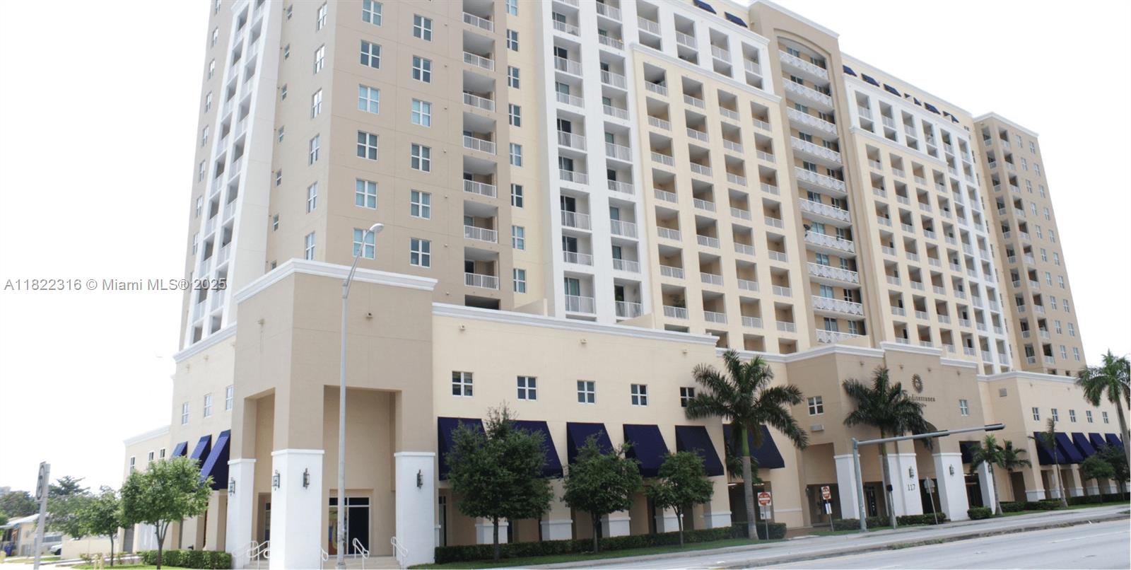 This spacious one bedroom,  15th floor unit boasting incredible views of vibrant city lights from large balcony. Unit features walk in closet, open kitchen with granite countertops, very spacious bathroom with granite countertops & a new washer & dryer in unit. New AC units in condo & on roof! New vinyl flooring throughout, new microwave and all impact windows & doors. Built in 2006 with great amenities, management on site with low maintenance fee. Covered assigned parking space & additional parking spaces for rent by association or other residents. Pool, with very large patio, Clubhouse, Sauna and well equipped Gym. Walking distance to several strip centers with restaurants, coffee shops and many other services.