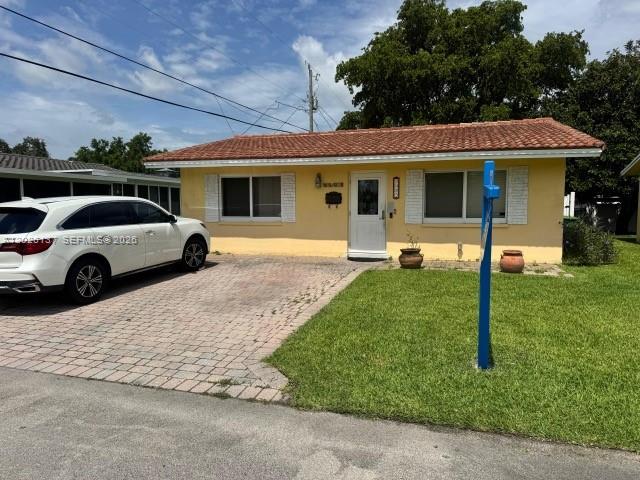 BEAUTIFUL 2-BEDROOM 1-BATHROOM SINGLE-FAMILY HOME IN TAMARAC LAKES FOR SALE.  FEATURES INCLUDE: UPDATED KITCHEN, WOOD CABINETRY, AND GRANITE COUNTERTOPS. FULLY ENCLOSED FLORIDA ROOM, FRONT PORCH, AND BACK PATIO.  ALSO INCLUDES 2 STORAGE SHEDS. HOA INCLUDES COMMUNITY POOL, CLUBHOUSE, LAWN SERVICE, FERTILIZATION, AND PEST CONTROL.