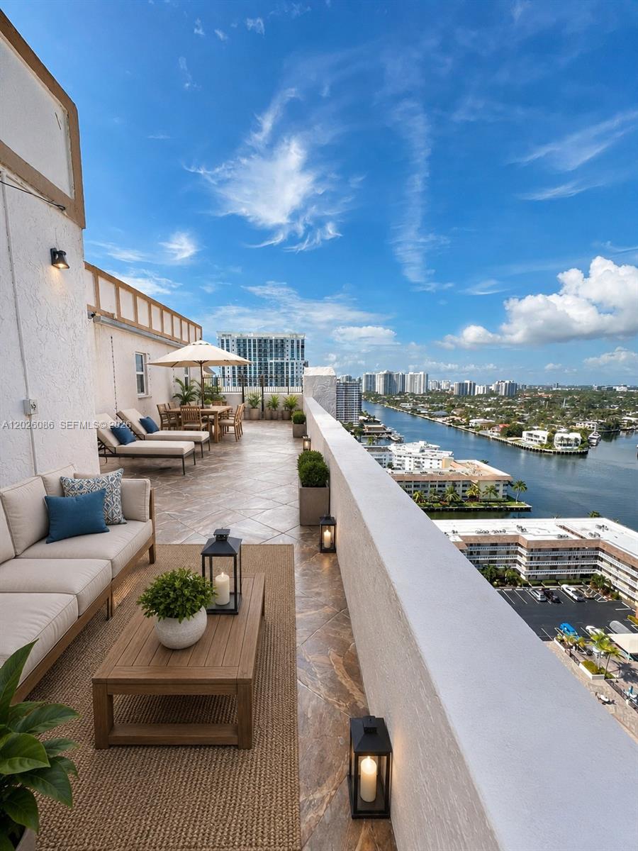 Rare opportunity to own one of only three penthouses in the highly sought-after Prince George. This expansive residence offers an exceptional layout, abundant natural light, and oversized east- and west-facing terraces showcasing breathtaking Intracoastal views, sparkling city lights, and most desired sunrises and sunsets.

One of the penthouse’s most unique features is the ability to have an in-unit washer and dryer — a privilege reserved exclusively for penthouse owners in the building. The thoughtfully designed floorplan offers incredible flexibility, including the easy potential to convert the space into a spacious 3-bedroom residence.

Enjoy generous closet and storage space throughout, along with the convenience of two dedicated parking spaces. Residents have access to an impressive array of amenities including tennis courts, resort-style pool, BBQ area, fitness center, sauna, billiards room, library, card room, and full-service doorman. Flexibility to be sold furnished or unfurnished.

Ideally located just moments from shopping, restaurants, grocery stores, schools, parks, Gulfstream Park, major airports, and religious centers. A playground directly across the street with public beach access, offering the ultimate South Florida lifestyle just steps from your door.

(Please note some photos have been virtually staged. Originals are also included).