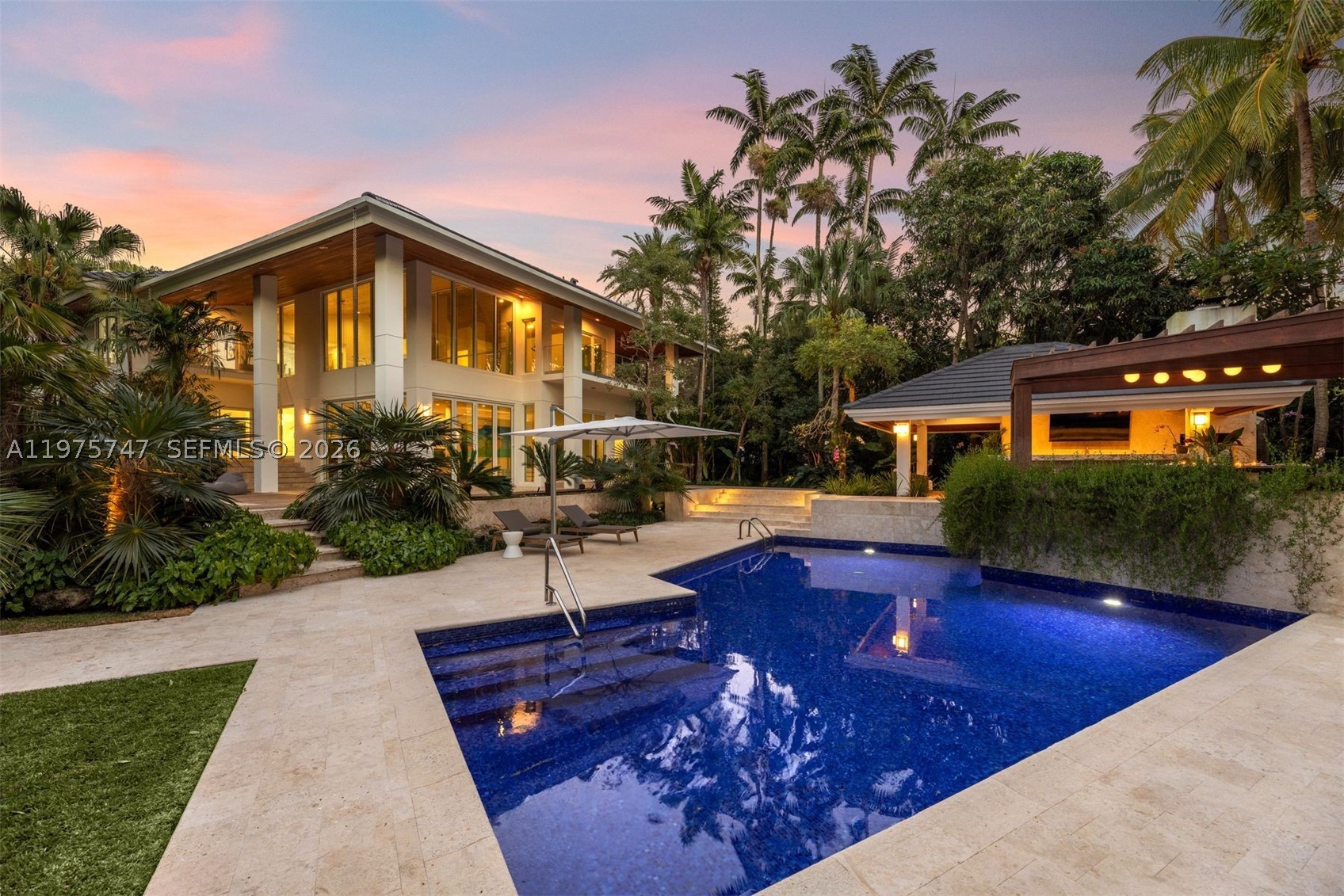 Secluded on a prime corner lot offering ultimate privacy in gated Cocoplum, this newly renovated just-under-7,674 sq ft home showcases lush landscaping by renowned architect Raymond Jungles and 250 feet of waterfrontage, including a 60-foot private dock. The open floor plan reveals soaring double-height ceilings, abundant natural light, 6 bedrooms, and 6.5 baths, creating an airy tropical sanctuary. The award-winning Italkraft chef’s kitchen features Sub-Zero and Wolf appliances. Impact glass throughout and European collapsible doors enhance indoor-outdoor flow. Indulge in a private wellness retreat with a commercial cold plunge, hot tub, steam shower, sauna, and dedicated gym. Additional features include a newly upgraded dock, Sonos sound system, whole-house generator, and a 3-car garage with Autostacker system. Enjoy top-rated schools nearby plus Cocoplum Phase 2 amenities: 24/7 security, yacht club, Olympic pool, tennis/pickleball courts, fitness center, clubhouse, and playground.
Schedule your private showing today!
