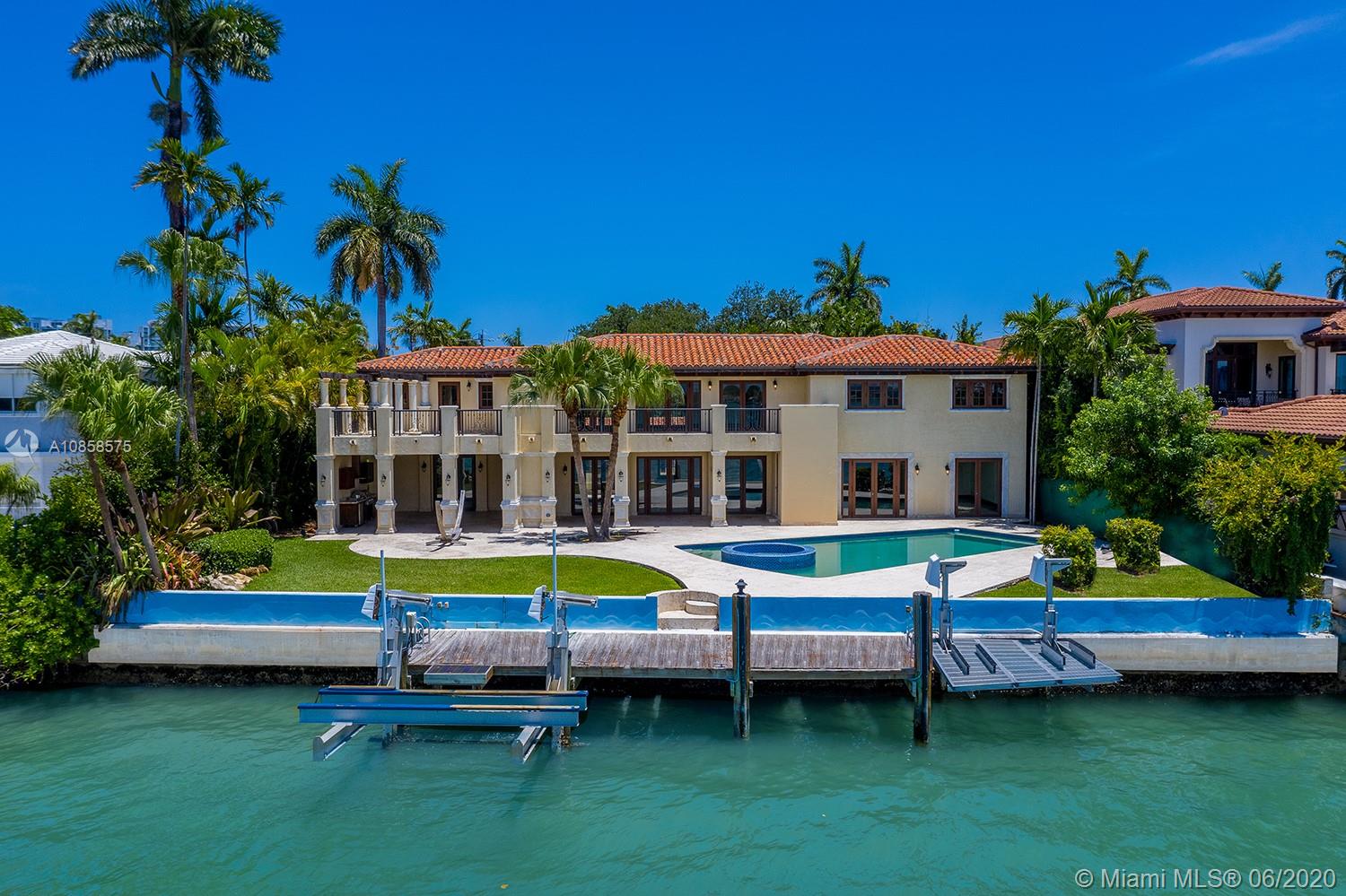 Experience the best views in Miami on this 25,215 SF lot. Incredible opportunity to live on coveted Upper North Bay Rd in this classic Pancoast waterfront estate. Offering 103 feet of sparkling waterfront on the wide bay, enjoy breathtaking bay and downtown Miami skyline views. With stunning views from every room, features include stone, marble and wood throughout, media room with a custom bar, principal suite with an oversized bathroom. The outdoors are perfect for entertaining complete with a heated pool with spa and a custom dock with boatlift. Available: Build your dream home with plans by renowned Brazilian architect, Marcio Kogan.