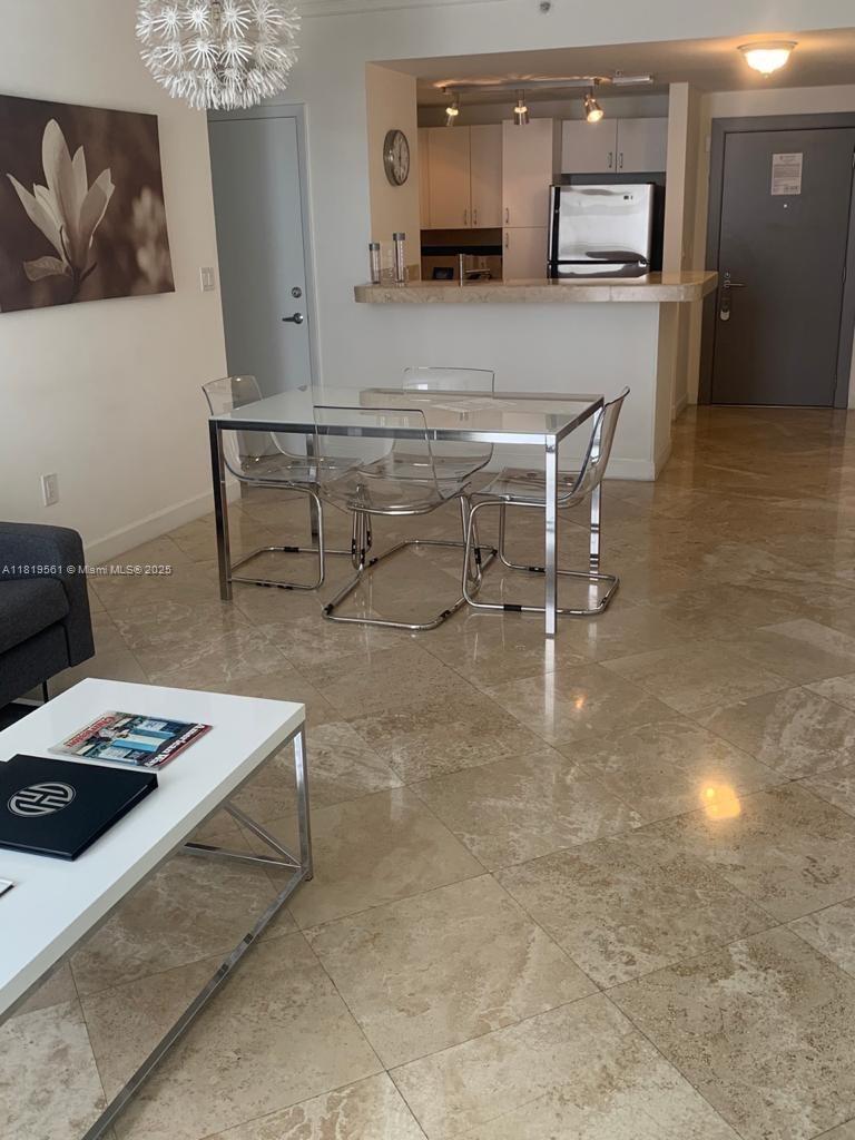Modern, furnished unit on the 20th floor. Tile flooring throughout, open kitchen area, walk in closet and washer/dryer in unit. Full-service building with lots of amenities including 24hr concierge and valet, restaurant, business center, swimming pool and large fitness center. Amazing location in the heart of Brickell, walking distance to shops, restaurants, banks and more!