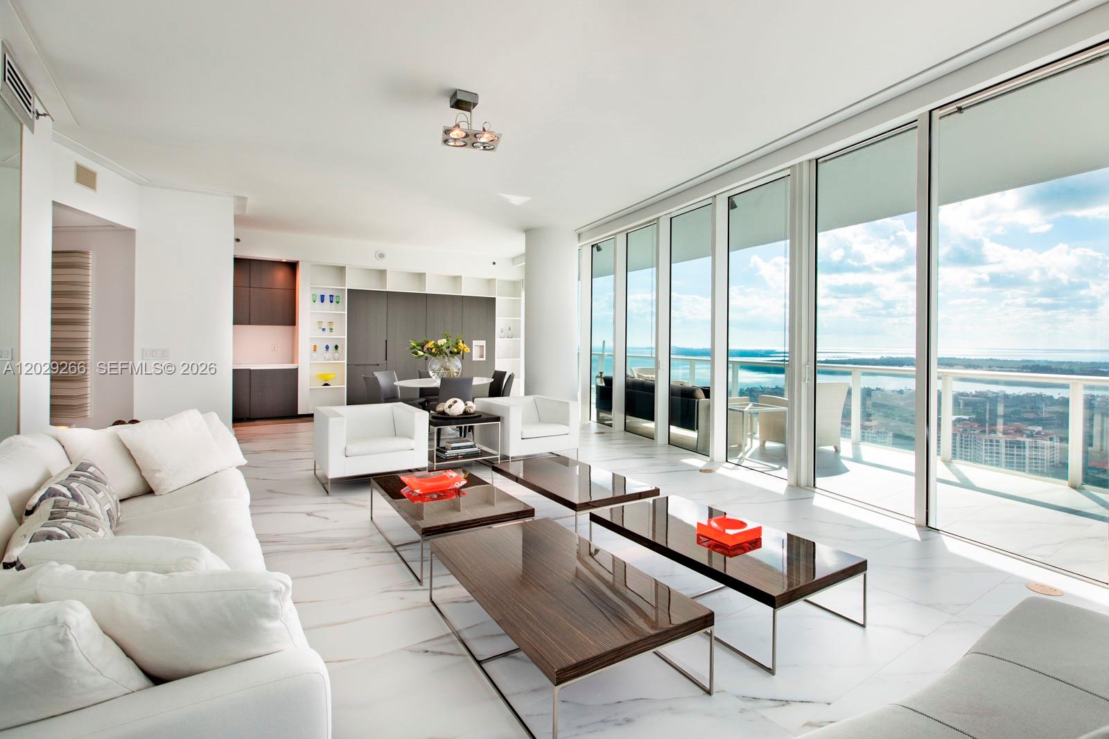 This fully renovated and elegantly furnished modern unit features two bedrooms, two full bathrooms, a half bathroom, a private elevator foyer, and panoramic views of the ocean, city, and cruise ship alley.
Continuum on South Beach provides 13 acres of luxurious resort-style amenities, including 1,000 square feet of white sandy beachfrontage, full beach and pool service, The Sporting Club—a 23,000 square foot gymnasium and spa with a variety of classes, The Tennis Pavillion with three clay tennis courts and a Pro-Shop, and The Patio—an alfresco dining experience for residents. Additionally, the property offers 24-hour security, valet parking, and concierge staff.