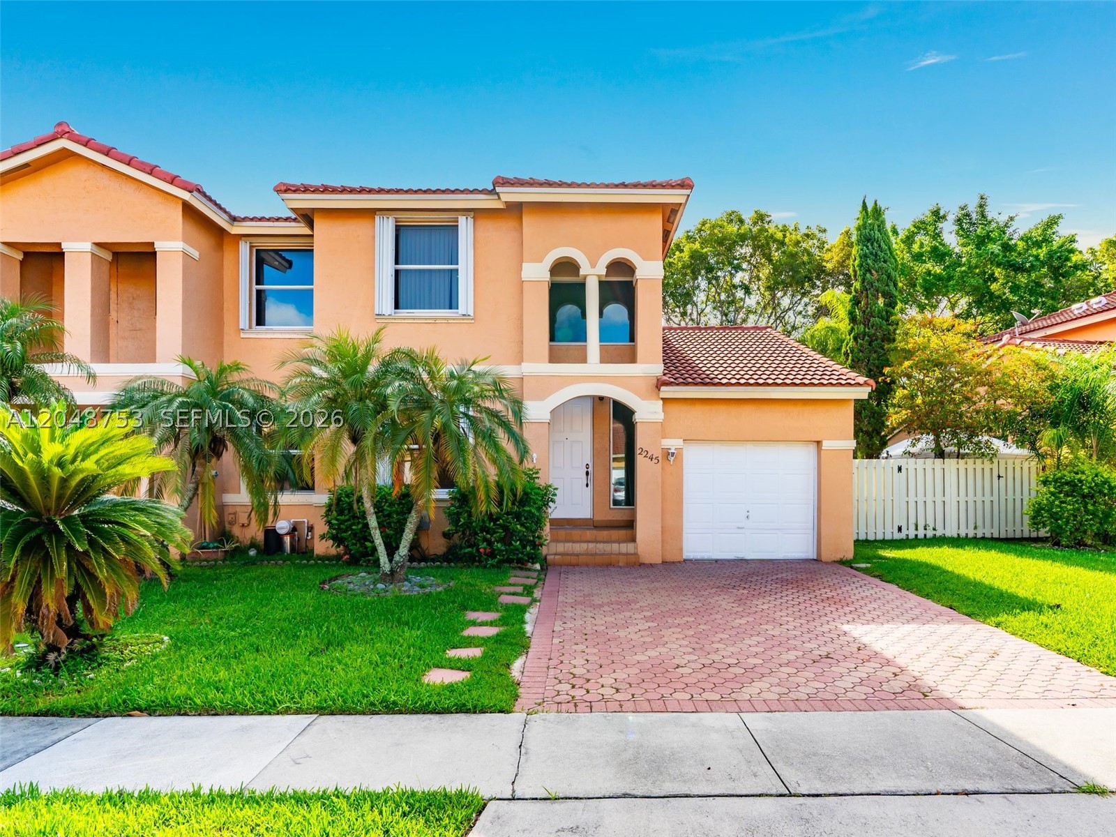 Discover this wonderful corner townhome located in the highly desirable community of Antigua, in the heart of Pembroke Pines. This 3-bedroom, 3-bathroom home features one bedroom and one full bathroom on the first floor, making it ideal for guests, a home office, or multigenerational living. Enjoy a private fenced backyard perfect for entertaining or relaxing outdoors, along with a one-car garage that provides added convenience and storage. Upstairs, the primary bedroom offers a walk in closet and a private balcony for additional outdoor space. The home is equipped with a combination of impact windows and accordion shutters for peace of mind. The roof was replaced in 2021, the HOA is responsible for all roof repairs, offering more value and low-maintenance living. Ideally located just minutes from major highways, shopping, dining, parks, and top-rated schools. This home offers the perfect blend of comfort, convenience, and location.