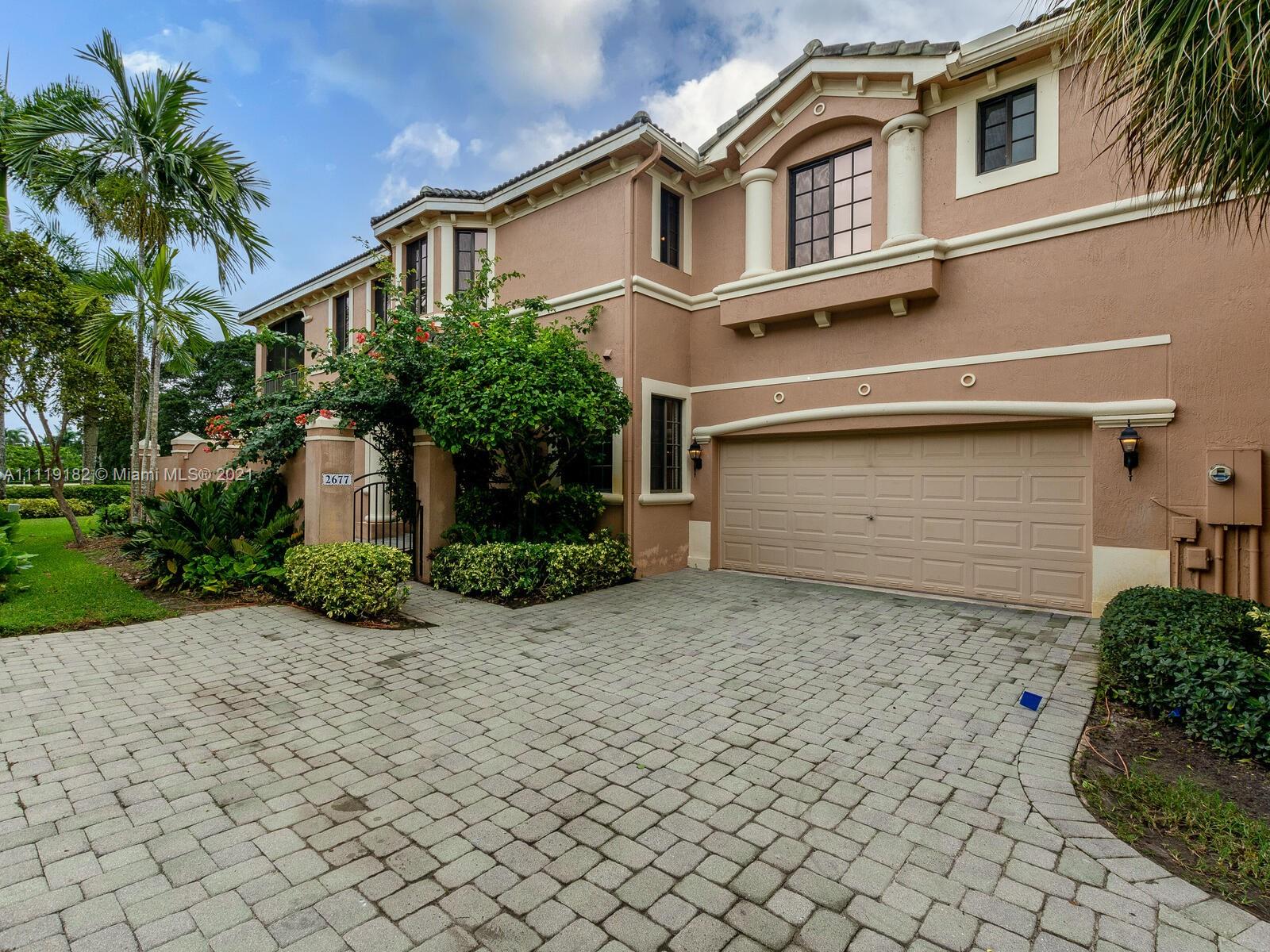 OWNER MOTIVATED!! WESTON HILLS LOCATION ACROSS FROM THE COUNTRY CLUB, TWO BEDROOMS PLUS DEN WITH THE MOST BEAUTIFUL GOLF VIEW IN THIS GORGEOUS COACH HOME, COMPLETELY TILED IN NEUTRAL COLOR, GOURMET KITCHEN WITH STAINLESS STEEL APPLIANCES, CALIFORNIA CLOSETS, STORAGE UNIT IN GARAGE, SCREENED COVERED PATIO, HUGE MASTER BEDROOM, DOUBLE SHOWER HEADS IN MASTER SHOWER, PAVERED PATIO, IMPACT WINDOWS, DOUBLE CAR GARAGE.