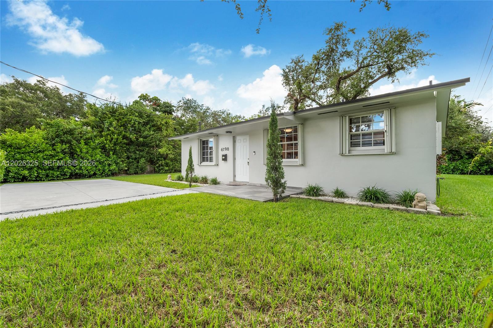 Charming fully furnished 3BR/2BA home in the highly desirable South Miami “City of Pleasant Living,” situated on an oversized corner lot with a desirable split floor plan. Recently updated, this residence features a galley-style kitchen with granite countertops, subway tile backsplash, and newer appliances. Additional interior features include neutral gray flooring, abundant closet space, upgraded interior and exterior doors, updated tile, and newer light fixtures. Major improvements include a new 2024 roof, 2022 A/C, washer & dryer, accordion shutters, & refreshed landscaping. The fully fenced backyard offers privacy, mature fruit trees, and ample space for outdoor enjoyment, pool, or future expansion. Move-in ready and offered fully furnished.