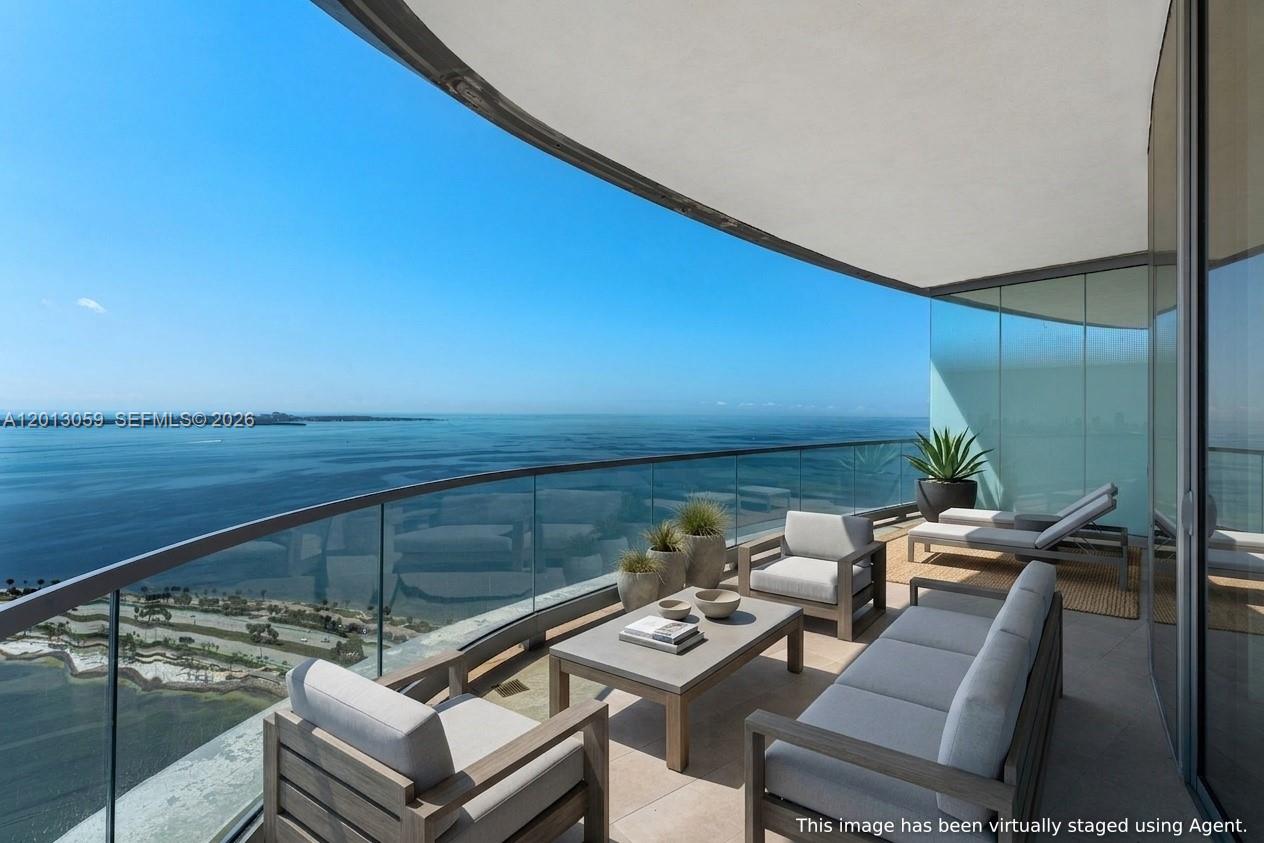 Perched high above Biscayne Bay in the iconic and newly completed UNA Residences, Residence 3601 is a breathtaking masterpiece where architecture, water, light, and design come together to create one of Miami’s most spectacular waterfront living experiences. With mesmerizing panoramic bay views, dramatic floor-to-ceiling glass, and extraordinary sunrise vistas that stretch endlessly across the horizon, this brand-new sky residence embodies the sophistication and glamour of Miami at its absolute finest. This exceptional 4-bedroom, 4.5-bath residence offers 2,743 SF under A/C plus 483 SF of expansive terraces, totaling 3,226 SF of seamless indoor-outdoor living. A private elevator entry opens into stunning open-concept living spaces inspired by the timeless elegance of luxury, blending warm natural materials with sleek contemporary design. The gourmet kitchen flows effortlessly into the grand living and dining areas and out to the waterfront terrace, creating the perfect setting for entertaining and enjoying Miami’s extraordinary bayfront lifestyle. Each bedroom is thoughtfully positioned to maximize privacy while capturing breathtaking water views from nearly every room. Residents enjoy world-class amenities including resort-style pools, spa and wellness facilities, state-of-the-art fitness center, elegant bayfront lounges, and curated social spaces, all within one of Brickell’s most prestigious new waterfront addresses.