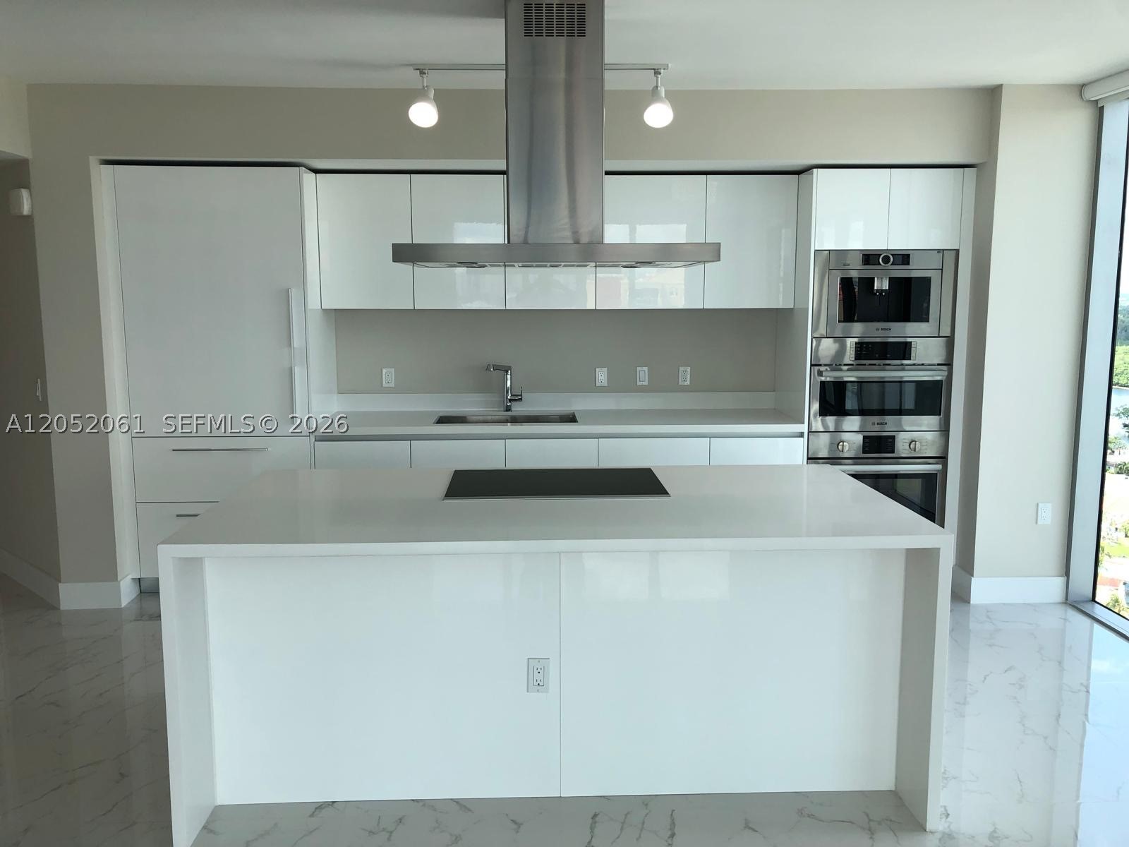 Waterfront Elegance in Sunny Isles Beach! Stunning 3-bed, 3.5-bath corner residence with breathtaking direct water views of the Intracoastal, and Miami skyline. This fully upgraded unit features 10ft ceilings, floor-to-ceiling impact glass windows, and a spacious wraparound balcony. The open floor plan boasts high-end European appliances, custom window treatments, designer lighting, and sleek finishes. The primary suite offers a walk-in closet and a spa-like bath with a soaking tub and glass-enclosed shower. Includes storage, 1 parking spaces + 1 valet. Enjoy resort-style amenities: infinity pool, lap pool, Beach Club, gym, spa, theater, game room, and more. Steps from the beach, dining & shopping. Schedule your private showing today!
