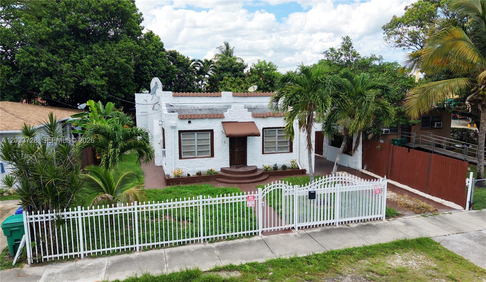 Great opportunity for first-time homebuyers or investors looking for income potential in the heart of Miami. Conveniently located near Miami International Airport, Wynwood, Downtown Miami, major highways, shopping, schools, and public transportation. This single-family home features 3 bedrooms plus a den and 2 bathrooms, with a functional layout that includes separate living and dining areas, a welcoming foyer/sitting area, and an additional den ideal for an office, playroom, or extra living space. Separate laundry area conveniently located off the kitchen. Spacious backyard with two concrete storage structures and ample parking with carport plus additional space for multiple vehicles. Property offers excellent potential to remodel, expand, or customize to your needs. Sold As-Is.