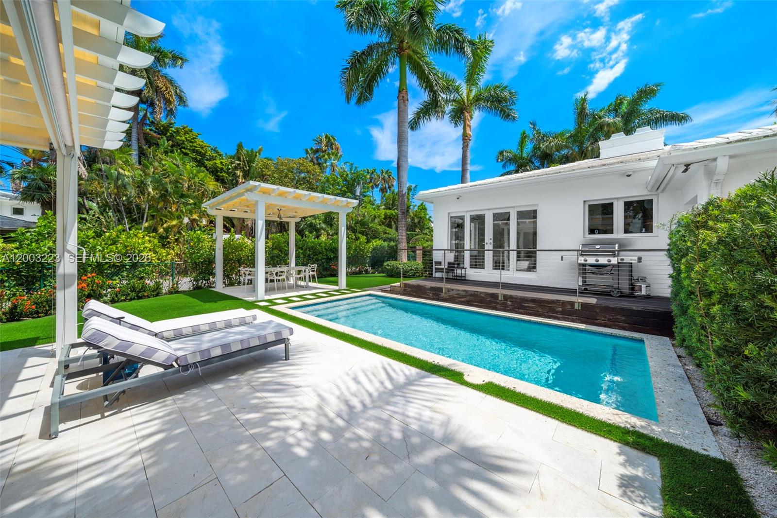Positioned on a prime corner lot on the coveted San Marino Island, this beautiful, updated 4-bedroom, 3-bath residence blends timeless charm with modern sophistication. Sunlit interiors unfold through an open, airy layout designed for effortless living and entertaining. At the heart of the home, a sleek, modern kitchen features custom European cabinetry and top-tier appliances, flowing seamlessly into the main living spaces. Outdoors, a private oasis awaits with a pool, generous yard space, and multiple areas to lounge or entertain. Each bedroom is well-proportioned, while the bathrooms are finished with curated materials and high-end fixtures for a clean, contemporary feel. Additional highlights include impact windows and doors and a one-car garage. Ideally located just off the Venetian Causeway, this home offers both privacy and convenient access to Sunset Harbour, South Beach, and beyond.