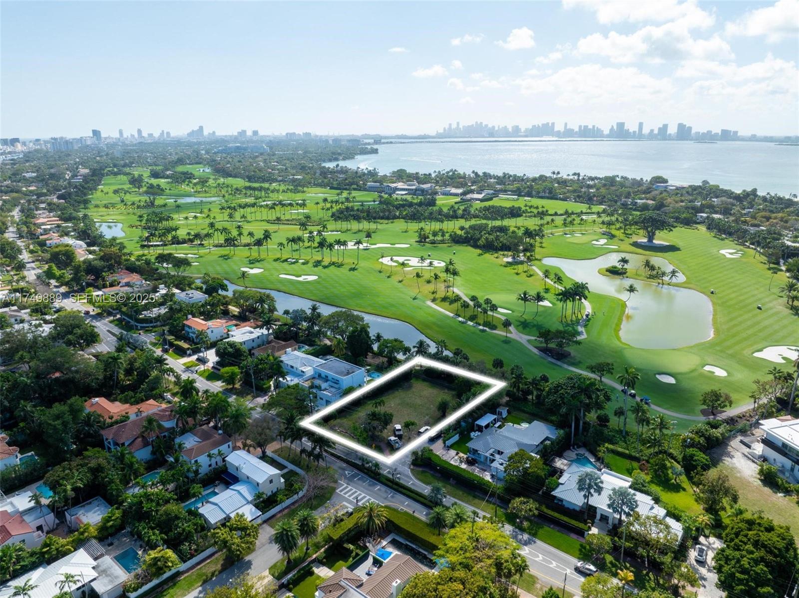 Prime land with approved plans. A tropical modern masterpiece on a prime lot with sweeping views of La Gorce Country Club. Designed by renowned Thamann Architecture, this home features warm ipe wood, board-formed concrete, and terrazzo cladding, blending seamlessly into its lush surroundings. Grand entertainment spaces and stunning green vistas define the best of Miami Beach living.