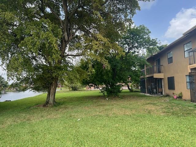 Remodeled 2/2 in Lago Grande Condominium. Gated community with security at gate. Unit located on the 2nd floor. Kitchen features wood cabinets, granite counter tops, new stainless steel appliances. Plenty of storage space. Balcony with lake view. Remodeled bathrooms. Washer and dryer in unit. Small pets allowed. 1 assigned parking space + guest parking. Tenant occupied $2350 until July 2026.