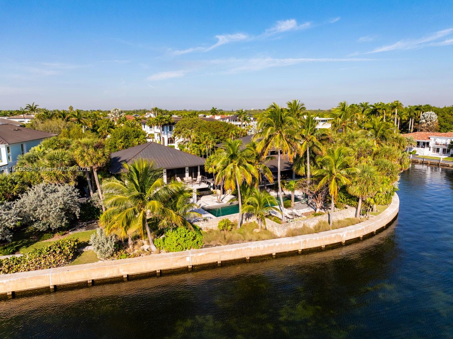 Once in a lifetime opportunity. Imagine your own private paradise in the gated community of Gables by the Sea. This spectacular estate sits right on the bay with over half an acre of lush landscaping designed by renowned architect Raymond Jungles. This is a boater and entertainer's dream home, with a family room with open bay views, summer kitchen, protected boat dock that holds a vessel up to 60ft and a boat lift that can hold 15k lbs. Completely renovated in 2018 with new roof, new wood and stone flooring, chef's kitchen with SubZero and Miele appliances, an oversized butler's pantry with wine refrigerators, gorgeous custom cabinetry and millwork throughout, high vaulted ceilings and full house generator.