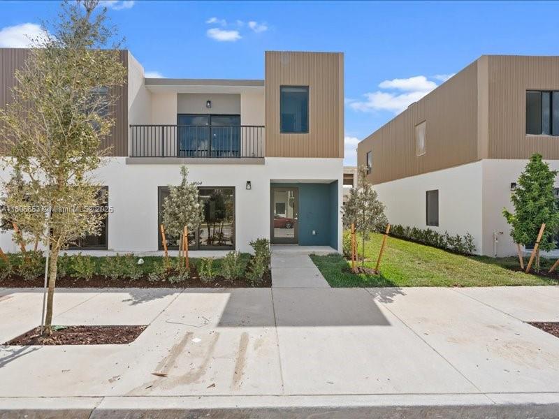 This multigenerational home offers comfort, privacy, and modern luxury for families of all sizes. Featuring X+ Construction with Pure Concrete and impact windows and doors, it combines durability, energy efficiency, and exceptional protection. Spanning multiple levels, it includes a 3-car garage for vehicles. EV Charger port connection included! The first floor offers a spacious, private suite, ideal for multigenerational living, guests, or a home office, with its own bathroom and easy access to the main areas. The open concept living space features a modern kitchen with stainless steel appliances and premium cabinetry, flowing into the dining and family rooms. Washer and dryer included on both floors! Beautiful porcelain tile flooring throughout the entire home.