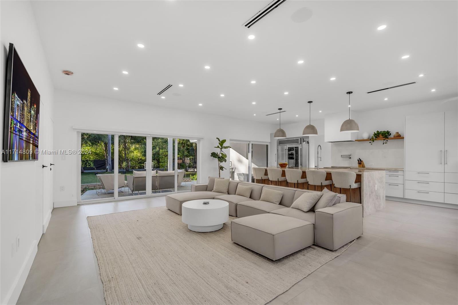 This remarkable 3 bedroom home is nestled on an expansive, landscaped lot with mature palm trees and ample green space for relaxation or entertaining. The stunning modern interiors feature a gourmet kitchen with high-end appliances, spacious open-concept living areas, and spa-like bathrooms with a steam shower and sleek finishes. Outdoors, enjoy a cold plunge and a covered patio for al fresco dining or unwind in the serene backyard. This property is ideal for those seeking privacy and a vibrant city lifestyle. Don’t miss this unique opportunity!