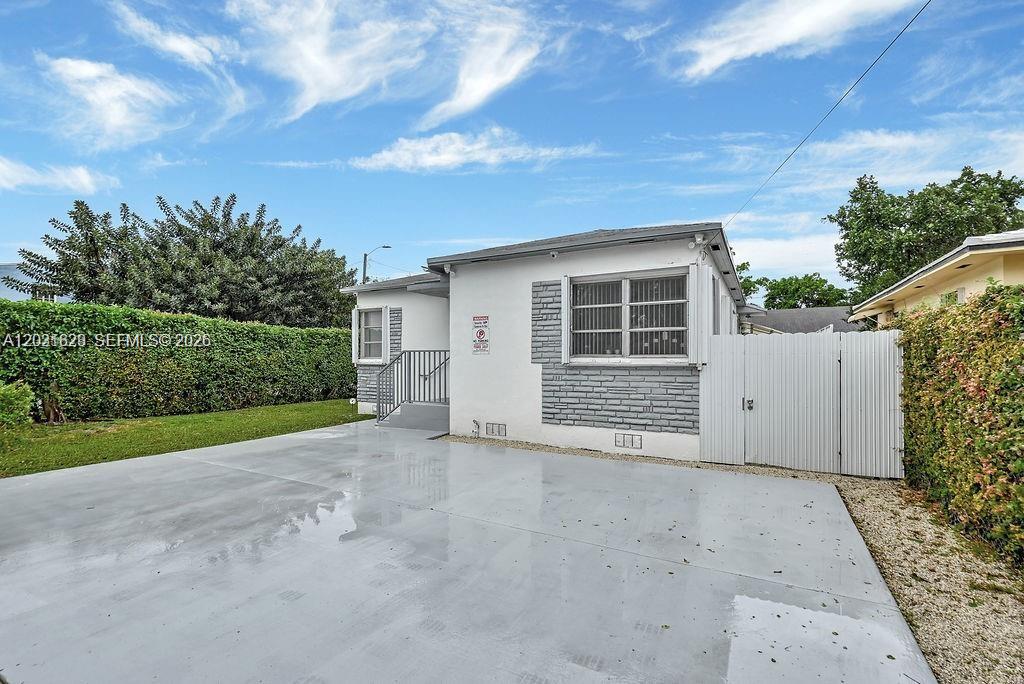 Stunning 3-bedroom, 2-bathroom residence situated on a corner lot near Le Jeune Road and Flagler in the heart of Miami. Nestled in a peaceful residential area, this home boasts an upgraded kitchen and bathrooms, as well as brand-new flooring throughout. The versatile layout allows for use as a 2-bedroom, 1-bathroom main living space with an expansive attached efficiency with its own private entrance and yard.