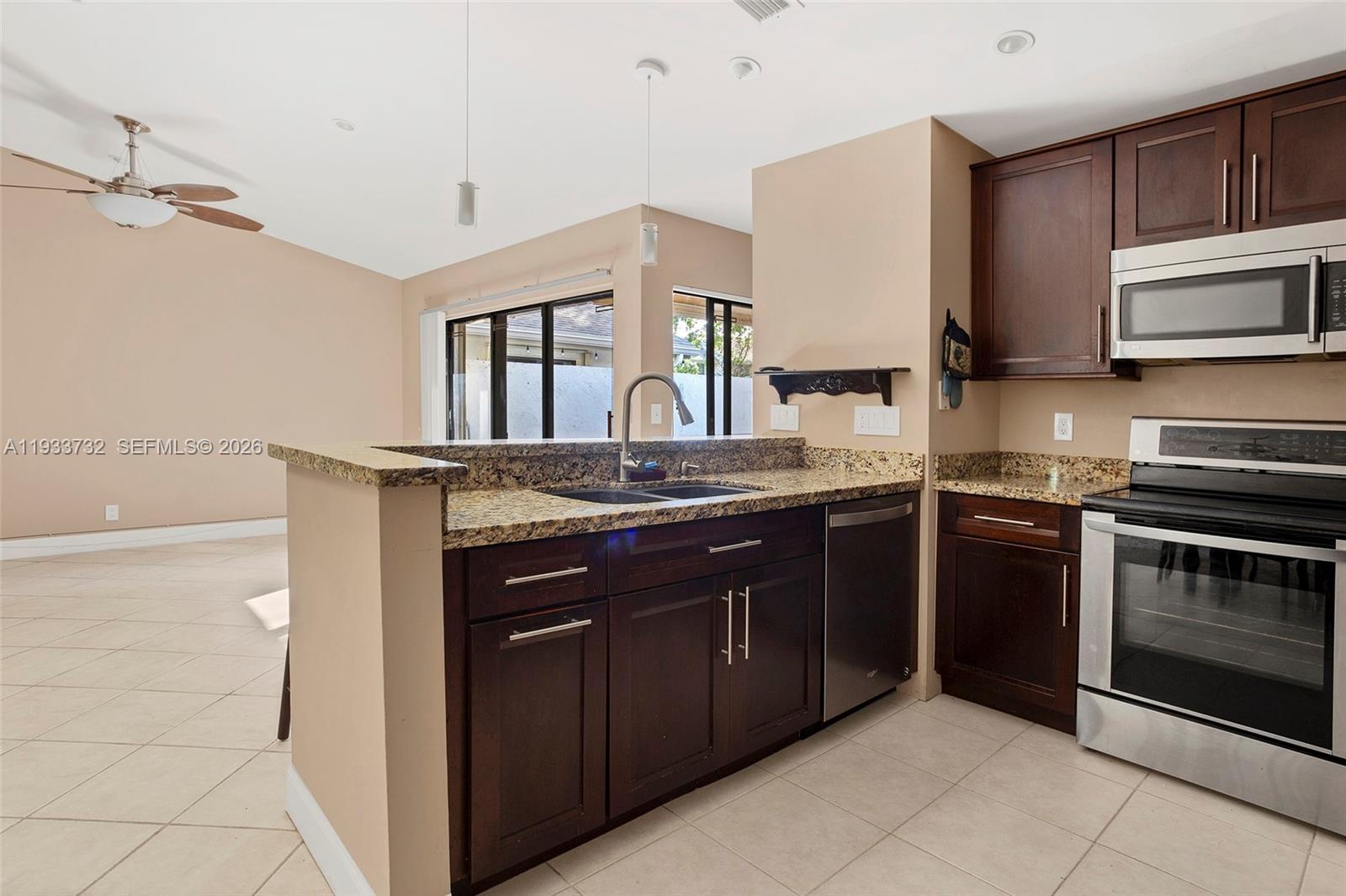 Welcome to easy living in this beautifully updated 3-bedroom, 2-bath villa tucked inside a quiet, gated community in Oakland Park. From the moment you walk in, you’ll notice the soaring vaulted ceilings and open layout that make the whole space feel light, bright, and incredibly inviting. Two skylights let the sunshine pour in, giving the home a warm, happy vibe all day long.

The kitchen has been completely refreshed with modern finishes, custom lighting, and high-end LG appliances—perfect for cooking and hosting friends. The home is in great condition, with thoughtful updates throughout that make it truly move-in ready. Plus, a newer roof and hurricane shutters (2017) add extra peace of mind.

Outside your door, you’ll love the community perks: a heated pool, gym, clubhouse, playground, and BBQ area—all surrounded by lush landscaping that makes it feel like your own private retreat.

Amazing location -  You’re just minutes from major highways, airports, the beach, and all the dining, shopping, and nightlife in nearby Wilton Manors.

If you’re looking for a home that’s stylish, low-maintenance, and in a great spot—this is it. Come take a look and see why it feels just right!