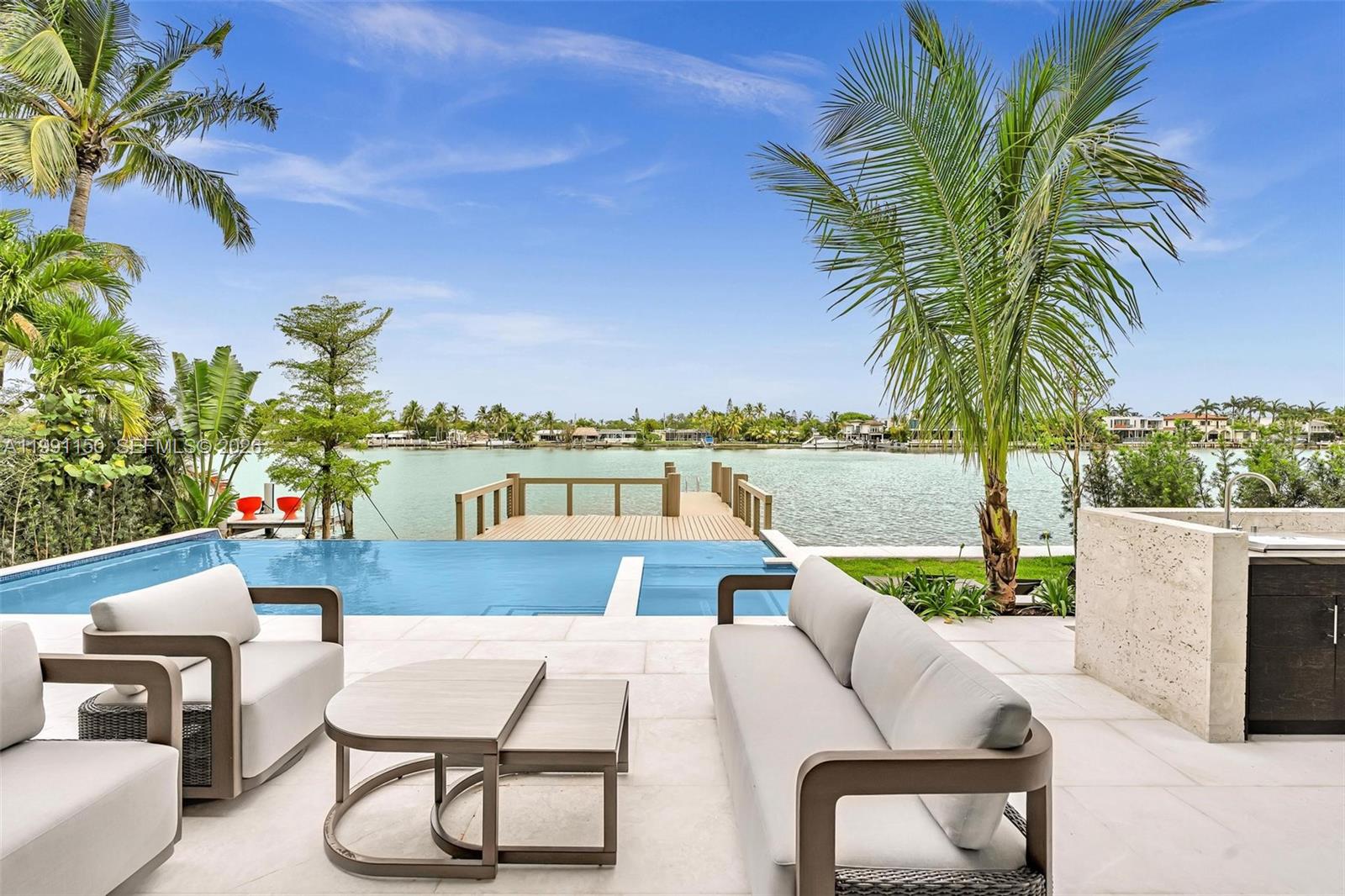Introducing an extraordinary waterfront sanctuary in Miami Beach’s exclusive Normandy Shores. This stunning residence features top-of-the-line Miele appliances, exquisite marble floors, and a striking illuminated marble vanity, all complemented by soaring high ceilings that fill the home with light and elegance.

Enjoy a lifestyle of unmatched luxury with access to premier amenities, including a golf course, clubhouse, restaurant, outdoor gym, and tennis courts. With breathtaking open bay views and direct ocean access, this home is a dream for boating enthusiasts and lovers of waterfront living.

Experience the pinnacle of Miami Beach luxury living.