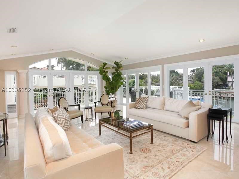 Located on desirable Riviera Dr in Coral Gables, this 4 bed/4.5 bath estate boasts 115 ft of waterfrontage with newly expanded private dock and boat lift, oversized rooms with the master suite situated on its own floor, media room, office, 2 wet bars and  panoramic views. Enjoy the convenience of only one bridge to bay on Gables Waterway or easy entertaining from 1300 ft of outdoor terraces overlooking the sparkling pool. Updated impact windows throughout.
