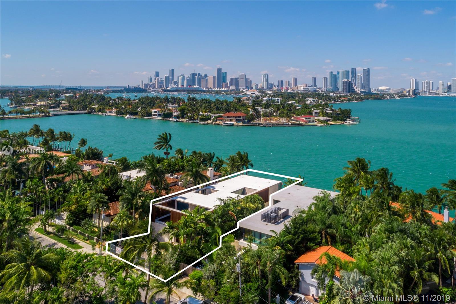 Milan-based, Architectural Digest 2019 Designer of the Year Quincoces-Dragò & Partners created a timeless experience on the Venetian intersecting light & space in Miami’s natural landscape. The facade of board-formed concrete, louvers and coral stone is the epitome of organic modernism. Multiple courtyards/terraces create a tropical dimension where interiors transition seamlessly to the exterior. Programming includes a grand 1,200SF master, upstairs lounge, cinema room,airy living areas, and balanced guest rooms & staff quarters. Purely architectural and thoughtfully curated with the highest materials and finishings. The resort yard offers covered seating and dining, Summer kitchen, new dock & lift, and a 40ft infinity pool to revel in Western views of sunsets and downtown nightscapes.