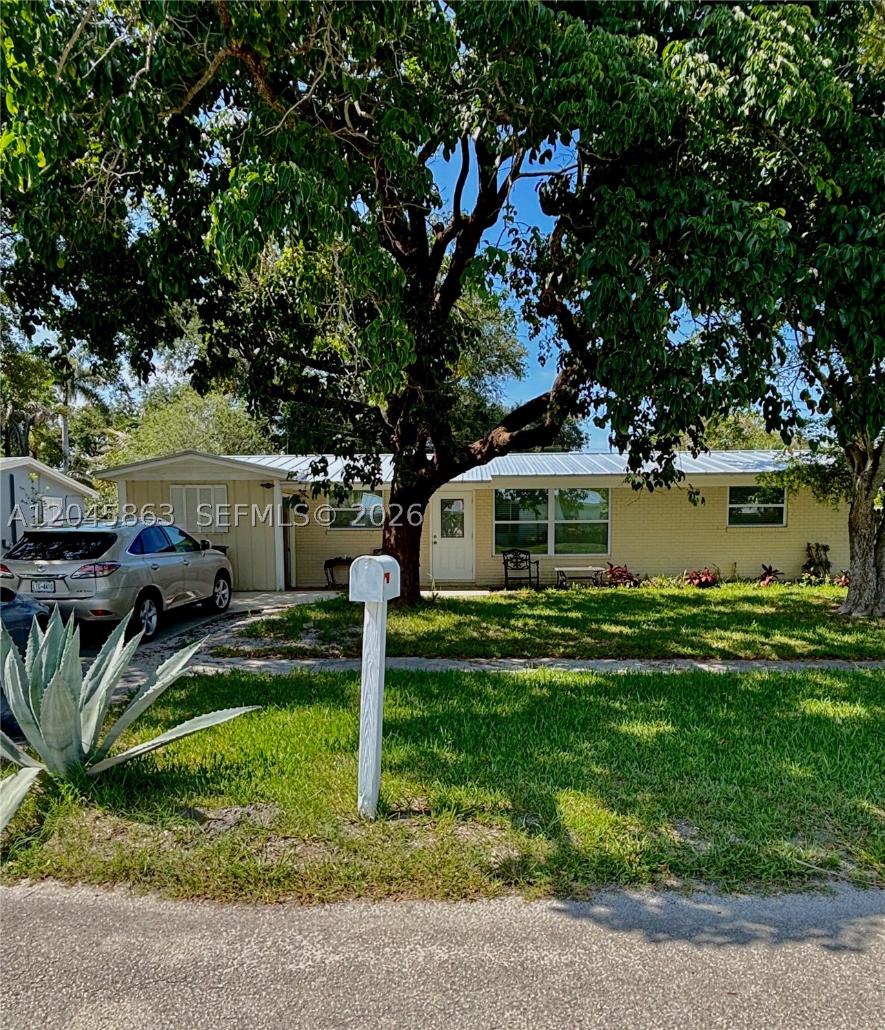 Ideal for transitional living, this beautifully updated 3 bed, 1.5 bath single-family home is available for a 6-month rental and offers a comfortable, turnkey experience. The home features a renovated 2023 kitchen with white shaker cabinets, granite countertops, a breakfast bar, and modern finishes. Enjoy the expansive living area accented by a stunning Mediterranean-style stone feature wall, adding warmth and character throughout. The split floor plan provides privacy, and the home includes ample yard space for outdoor enjoyment.