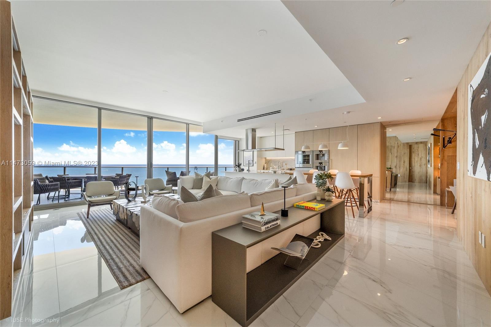 Welcome to this meticulously designed turnkey residence at The Ritz Carlton Residences in Sunny Isles Beach. This is a fully finished and furnished designed smart home with beautiful furniture and wood finishes throughout. The residence showcases a masterful panorama, encompassing uninterrupted views of the ocean, cityscape, and the serene Intracoastal waterways. With 3 bedrooms, an additional family room, 3.5 bathrooms, and an exclusive private elevator, graced by 10-foot ceilings. Culinary enthusiasts will find delight in the gourmet Gaggenau kitchen, equipped with sleek Snaidero cabinetry and adorned with premium Ceasarstone quartz countertops.