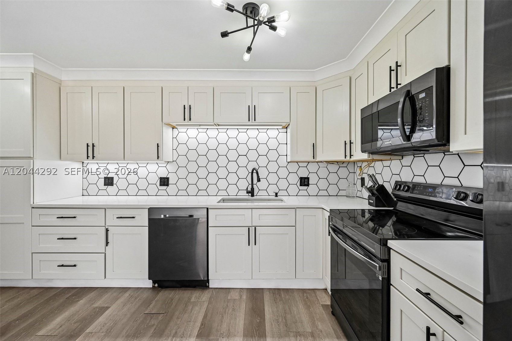 Beautifully remodeled 2-bedroom, 2-bath townhouse featuring brand-new LPV flooring throughout and a custom-designed kitchen with modern finishes. The home includes a new enclosed water heater and AC for added efficiency and peace of mind. Located in a well-maintained community with an HOA fee that remains budget-friendly. This move-in-ready property offers comfort, style, and convenience. Schedule your showing today.