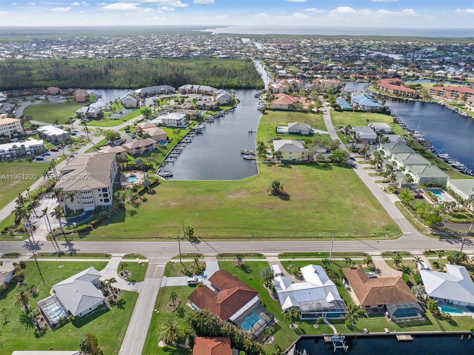 Back on the market, the buyer changed his mind. Prime development opportunity in the Punta Gorda Isles community! This 2.44-acre waterfront parcel offers 265 feet of saltwater canal frontage with direct sailboat access to Charlotte Harbor and the Gulf. Zoned GM-15 for multifamily use, this site is well-suited for a waterfront condominium or apartment project. City-owned and maintained seawall, public utilities, and no HOA—optional civic association available. Convenient to shopping, dining, parks, and just a short drive to historic downtown Punta Gorda. An opportunity to develop in one of the area’s most desirable waterfront communities.