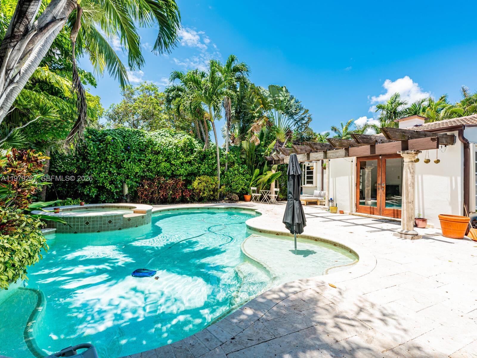 Rarely available, fabulous pool home with paved circular drive on a quiet street in Surfside. This 3 bedroom 2 bathroom home has tons of charm.  Living room has vaulted ceilings and fireplace.  Kitchen has granite countertops
and good cabinet space. Cozy den and Florida room too! French doors lead to a beautiful pool and spa with large private patio and beautiful landscaping. Walking distance to Surfside shops, Houses of Worship and world famous
Bal Harbour shops.  Property is also being offered annually at $ 5600.00 per month.