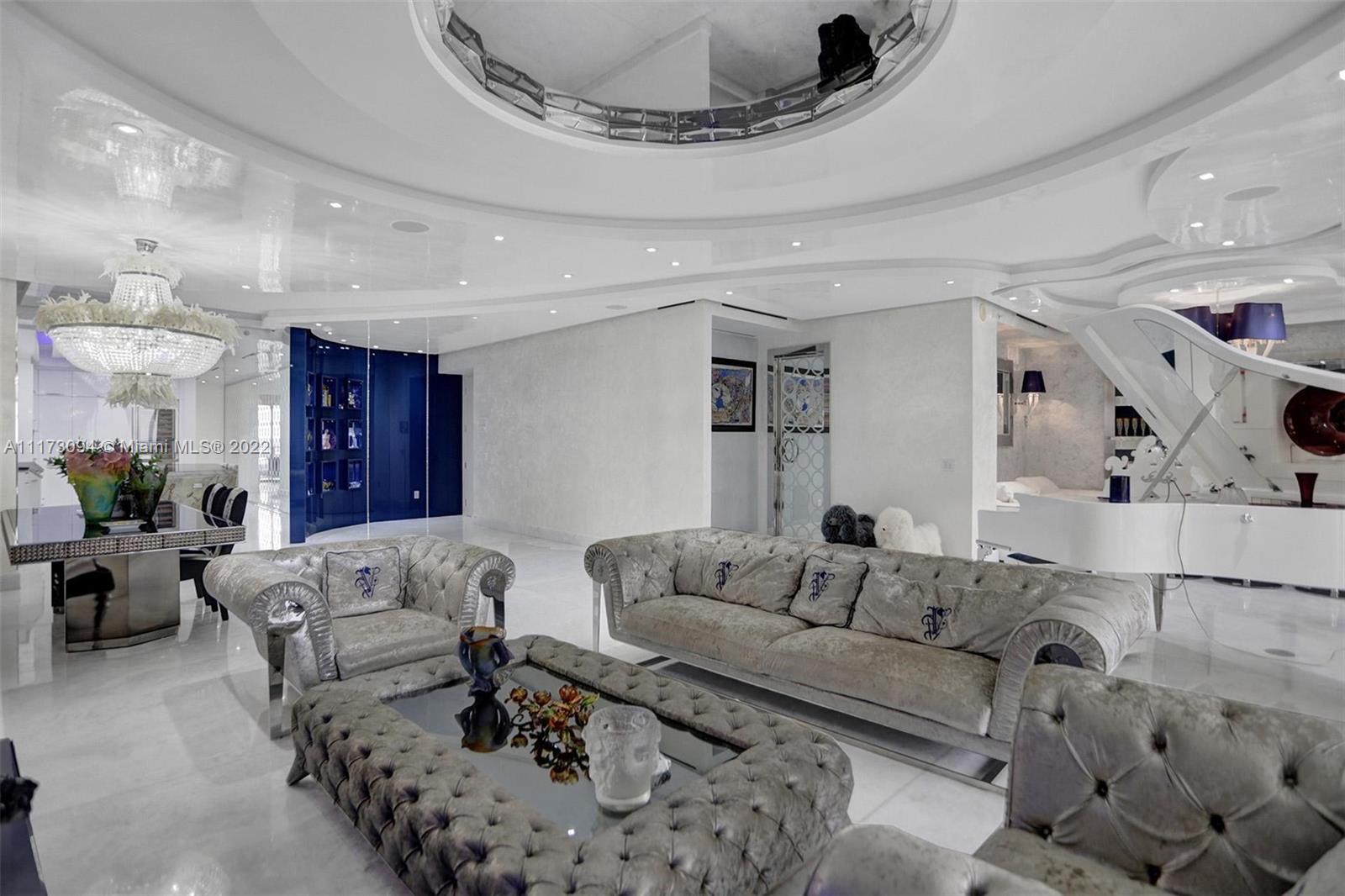 Gorgeous spacious unit with direct ocean and city views, 3 bdr + DEN/3.5bth in St Regis, Bal Harbour.  Very spacious and large unit features sleek floors, pearlescent venetian stucco throughout, drop ceilings, customized lighting, high-tech built-in appliances. Enjoy the ocean and bay/city skyline views. Every room in a unit was designed to perfection by famous designer Roberto Cavalli and was also beautifully furnished with Visionaries Furniture, created by Cavalli. Living at its finest, St. Regis offers 5-Star resort amenities with a 24 hour concierge and room service, private oceanfront cabanas, separate residents amenities, full service spa, 4 pools, three restaurants and more.