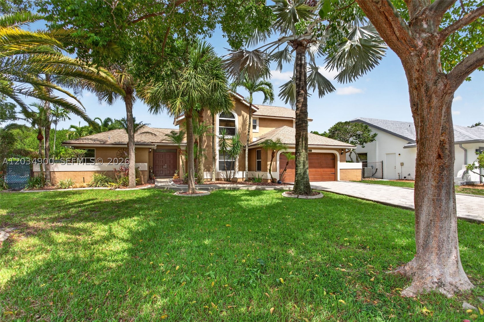 Welcome to this beautifully maintained two-story home situated on a desirable corner lot in the sought-after Winston Park community. Featuring 4 bedrooms and 3 full bathrooms, this spacious residence offers a thoughtfully designed floor plan with the primary suite conveniently located on the first floor.
The home boasts soaring vaulted ceilings and elegant wood flooring throughout the main living areas, while the second floor features newer laminate flooring for a fresh, modern feel. The updated bathrooms add style and comfort, and the dedicated laundry room provides everyday convenience.
The heart of the home is the open kitchen area, complete with a casual dining space that flows seamlessly into the inviting family room—perfect for entertaining and family gatherings. Step outside to your private backyard oasis featuring a sparkling pool, relaxing spa, and fully fenced yard, ideal for enjoying the Florida lifestyle year-round.
Additional highlights include a 2-car garage and an excellent location with easy access to the Sawgrass Expressway and Florida Turnpike. Residents will appreciate the abundance of nearby shopping, dining, and entertainment options, making this exceptional property the perfect place to call home.  selling agent provides a one year home warranty at closing. Trimlight – Permanent, Programmable LED Systems comes with life-time warranty