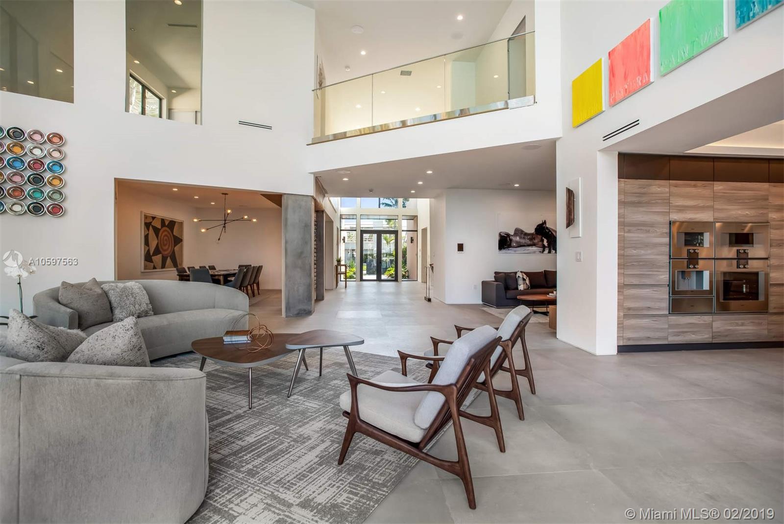 Gorgeous contemporary waterfront estate w/gated entry on prized Venetian Island. Magnificent setting w/lush foliage, climate-controlled pool, waterside patio & lawn, designer landscapes/lighting + private dock. Exquisite bay & city views from your outdoor oasis & walls of windows in the impeccably-redesigned 5,600SF home offering the ultimate luxury. Bathed in light, enriched by the finest finishes including Italian porcelain tile & American white oak engineered wood flooring, Italian matte lacquered doors by BERTOLOTTO, chef’s kitchen w/cabinets by Scavolini & appliances by Gaggenau & elegant spa baths. Entertain in the large living area w/double-height ceilings & massive bay view windows. Amazing glass wine cellar, state-of-the-art security, Lutron smart lighting, home automation & more.