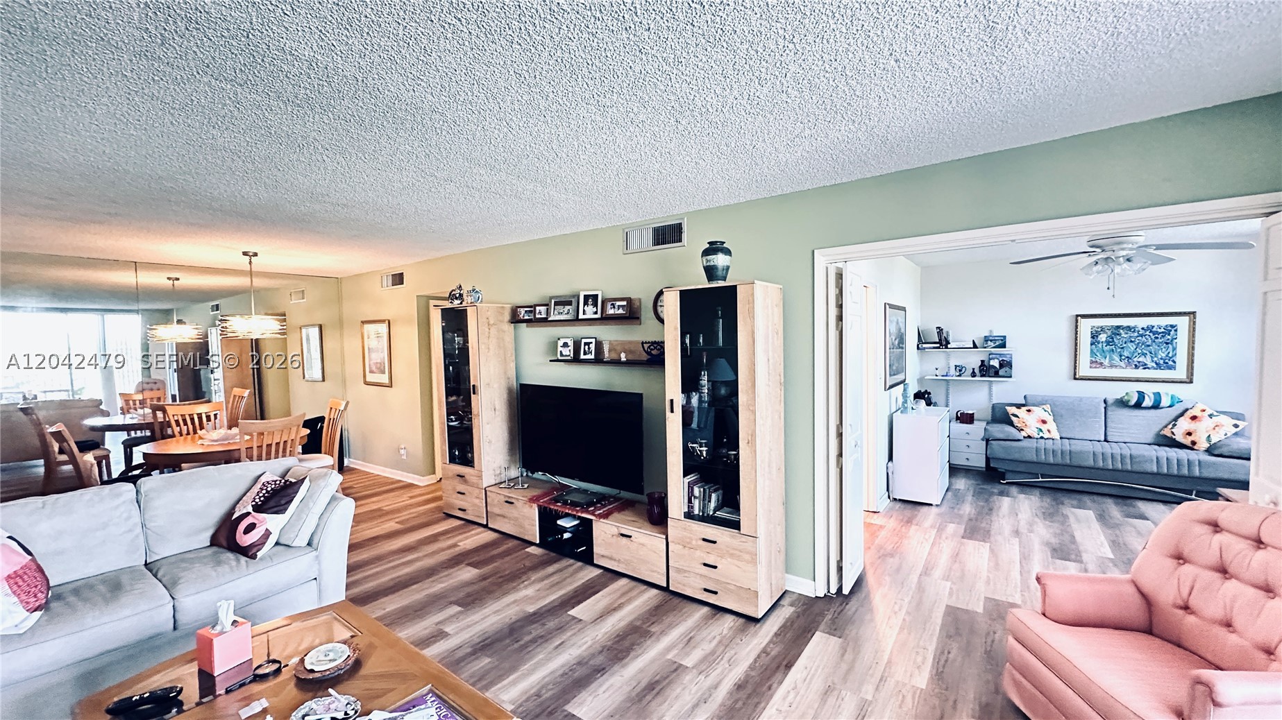 Bright & beautifully maintained 2 Bd/2 Ba condo in the desirable Palm Aire Country Club all-age community with stunning golf course views from your large screened-in balcony! Featuring a spacious master suite with ensuite bath and walk-in closet, plus generously sized guest bedroom and ample storage throughout. Open floor plan seamlessly connects living and dining spaces — ideal for relaxing or entertaining. Situated directly across from the clubhouse with two large pools, common room, terrace with BBQ grills, and shuffleboard courts. Enjoy resort-style living with a nearby park offering tennis, pickleball, playground & more. Conveniently located near shopping, dining, major highways, 3 major airports, a new casino, and cozy coffee shops — just 5 miles to the Pier, entertainment & sandy beaches. South Florida living at its best!