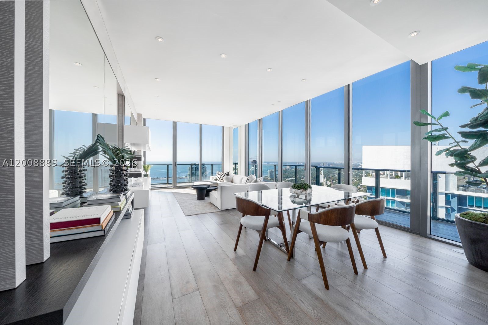 Stunning 2 Story Brickell Penthouse offering YOUR PRIVATE ROOFTOP TERRACE WITH PLUNGE POOL and over 1,100 SF of additional outdoor living space. This sophisticated two-story corner residence is fully furnished and designed for turnkey living. Featuring 4 bedrooms and 3.5 bathrooms, the home showcases refined finishes, curated artwork, and a well-designed layout. Floor-to-ceiling windows and a wraparound balcony capture breathtaking ocean and city views. A custom wood-frame spiral staircase leads to the expansive rooftop terrace, perfect for entertaining, complete with Italian porcelain tile, electric grill, outdoor refrigerator, and private plunge pool.  DUA Residences offers the perfect balance of private convenience and 5 star resort style amenities. Exceptional privacy, design, and iconic Brickell views.