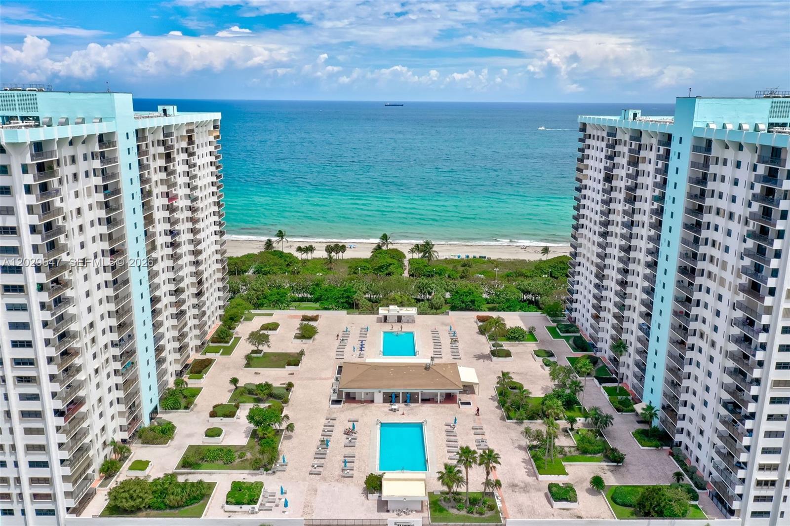 Wake up to breathtaking ocean, Intracoastal, and pool views from this beautifully renovated 2-bedroom, 2-bath residence in The Summit, one of Hollywood Beach's premier oceanfront communities. This move-in-ready unit features a bright, open layout, an eat-in kitchen, and a spacious private balcony perfect for enjoying South Florida's coastal lifestyle. The desirable split-bedroom floor plan offer two spacious primary suites with walk-in closets and ensuite baths. Additional features include impact windows, abundant natural light, and an in-unit washer and dryer. Residents enjoy an exceptional resort-style amenity package, including two heated saltwater pools, tennis courts, fitness center, game rooms, basketball courts, a private restaurant, and direct beach access. Covered parking and additional storage are also included.  Ideally located on the world-famous Hollywood Broadwalk, just steps from restaurants, shopping, and entertainment.  A rare opportunity to own a turnkey beachfront residence, vacation retreat, or investment property in one of South Florida's most desirable oceanfront locations. The unit is currently tenant-occupied, providing immediate rental income for investor or future personal use. The special assessment has already paid and there is no outstanding balance.