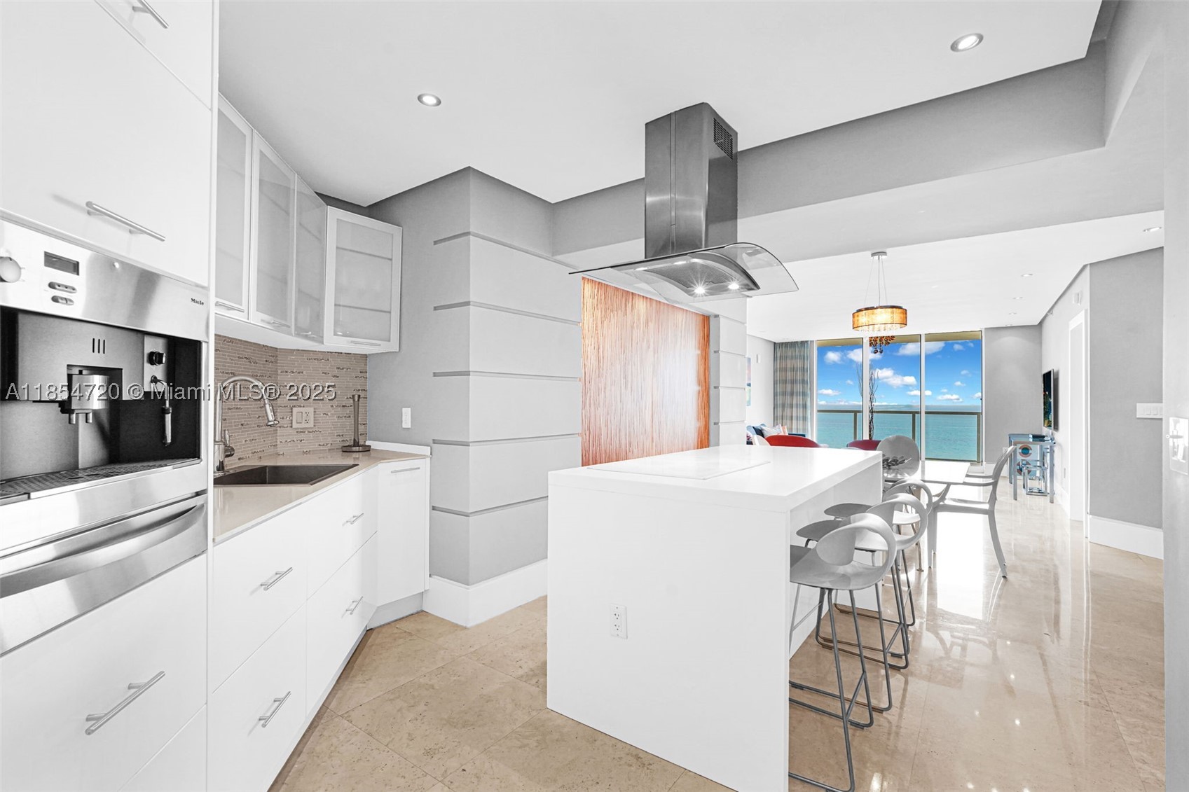 Rare Opportunity to own a 2 + Den beachfront jewel including one assigned parking space, with two additional spaces available for purchase—an exceptional convenience in this coveted beachfront location. With the option to rent up to 12 times per year, this property offers both luxurious living and an outstanding investment opportunity. Experience the coastal living in this exquisitely renovated residence, offering uninterrupted ocean and city views. 
The open-concept kitchen and the contemporary design ideal for entertaining. 
The versatile den has been transformed into a spacious third bedroom,   Resort-style amenities and a location second to none ensure you are always steps from the best dining, shopping, and leisure activities.