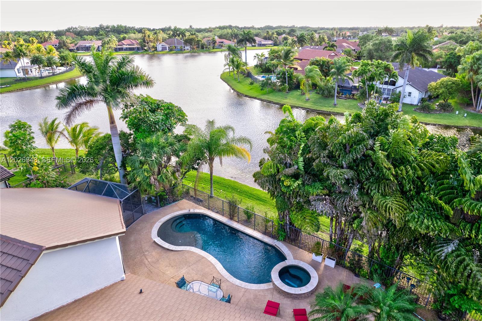 Welcome to your private lakefront retreat in the prestigious gated community of Tequesta in Weston. Situated on a peaceful cul-de-sac, this beautifully maintained home offers the perfect blend of comfort, elegance, and the South Florida lifestyle. Featuring 4 spacious bedrooms plus a versatile extra room ideal for a home office, gym, playroom, or guest space, this residence is designed for both everyday living and entertaining. Soaring volume ceilings and abundant natural light create a bright, open ambiance throughout. The kitchen features
rich Brazilian wood cabinetry, granite countertops, and stainless steel appliances. Step outside to your own tropical oasis with a heated saltwater pool and spa, expansive screened patio, lush landscaping, and tranquil lake views, the perfect setting for relaxing evenings and breathtaking Florida sunsets.
Located within one of Weston's most desirable 24-hour guard-gated communities, residents enjoy access to top-rated schools, nearby parks, scenic walking and biking paths, and convenient access to I-75, Sawgrass Expressway, Weston Town Center, shopping, dining, and more. A rare opportunity to own a true waterfront gem in one of South Florida's most sought-after cities.
