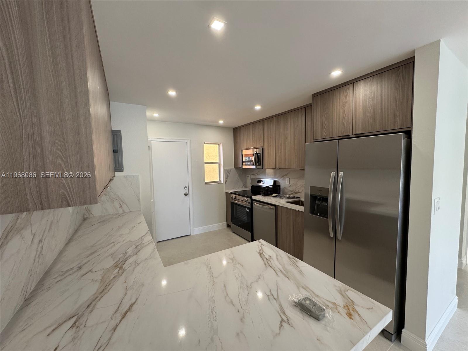 NEW, NEW, NEW, just remolded - No expense spared, be the first to enjoy this newly remodeled designer unit, completely new kitchen, bathrooms, floors, built-in closets AC, water heater, and LED lighting throughout. Best unit in the building! Located just minutes from the Westland Mall, City Park, highway and more.