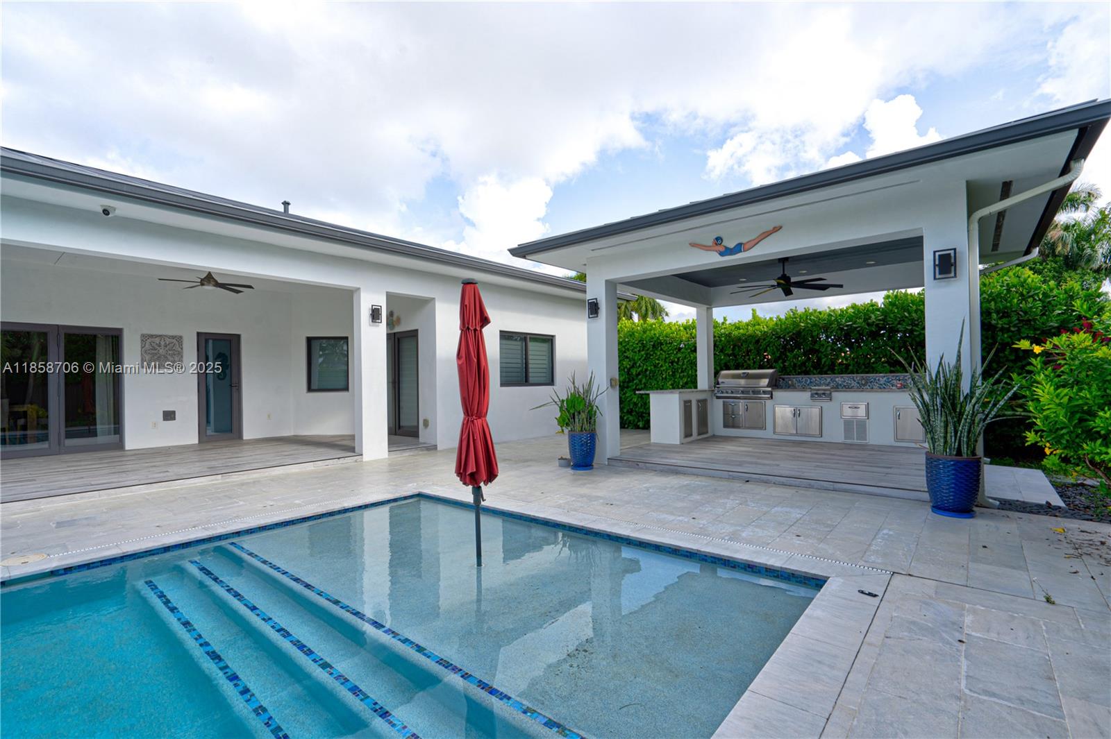 Spectacular 3 Bedroom - 3 Bath on a Private Cul-de-Sac!
Stunning, custom-designed residence offering 3,179 sq. ft. of highly refined living space, plus an additional 225 sq. ft. cabana. Step inside to experience an open area and high ceiling -  floor plan featuring top-of-the-line finishes throughout. From the high-impact windows and plantation shutters to the metal roof and LED lighting, every detail has been carefully crafted for comfort, style, and durability.
The outdoor space is an entertainer’s dream—relax or host guests in the Huge resort-style pool and enjoy year-round outdoor dining under the 15' x 15' cabana, complete with a built-in kitchen and grill.