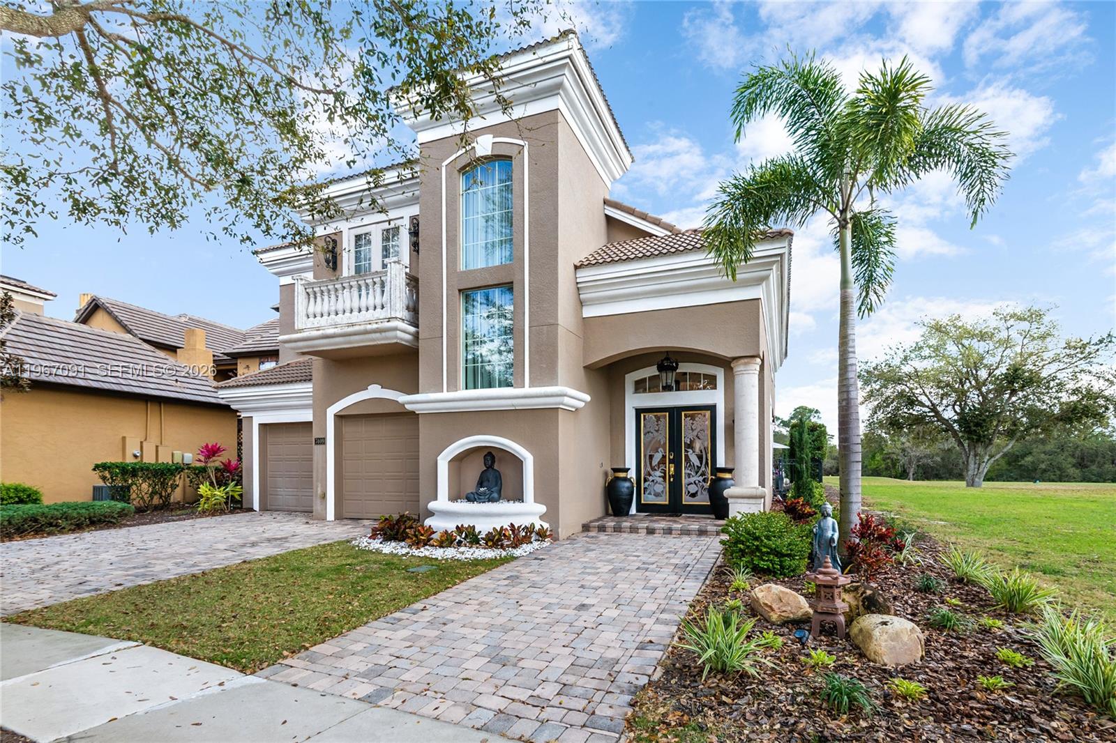 Welcome to 7409 Gathering Ct, a fully remodeled Mediterranean estate in prestigious Reunion Resort, perfectly positioned on the #5 tee box of the Watson Golf Course. This elegant 5-bedroom, 5.5-bath pool home offers 4,200 sq ft of refined living space with stunning golf views.
Each bedroom features a private en-suite bath. The grand foyer opens to beautifully appointed living areas with crown molding, arched entryways, high-end tile flooring, and granite finishes throughout. The open layout flows into a spacious living room with double sliding doors overlooking the pool and fairway.
The chef’s kitchen includes premium cabinetry, granite countertops, a five-burner gas range, center island, and pantry. Upstairs, two expansive primary suites offer sitting areas and balcony access. 
Designed for entertaining, the outdoor space includes a private pool, two covered lanais, and an outdoor kitchen with grill. A dedicated theater room with 144” screen, five theater chairs, and wet bar completes the experience.
Recently repainted exterior and cleaned tile roof. Ideal as a luxury primary residence, vacation home, or investment property.
Reunion Resort offers three signature golf courses, 12 community pools, water park, tennis courts, dining, spa, and is minutes from Disney, Universal, SeaWorld, Orlando International Airport, and Florida beaches.