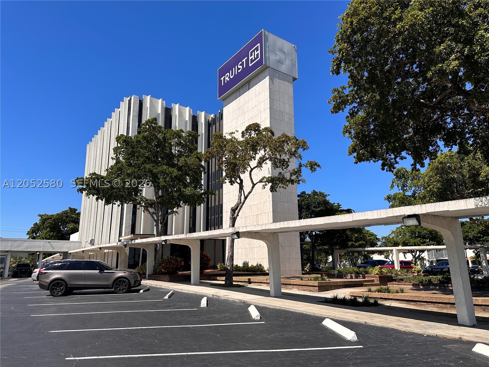 Truist Bank-anchored office building located directly on State Road 7/US-441 in Lauderhill, offering strong visibility and convenient access within the Fort Lauderdale submarket. The property consists of approximately 32,200 SF of leasable space on a ±1.86-acre double lot with more than 130 on-site parking spaces. The four-story building includes a functional basement level and approximately 27,000 SF of available space, creating an ideal opportunity for an owner-user or investor seeking lease-up potential. Truist Bank occupies approximately 4,600 SF on the first floor and is currently paying $9,583.33 per month NNN plus CAM under a lease expiring in February 2028, with four additional five-year renewal options and 10% rental increases. Recent improvements include brand-new elevators and a well-maintained roof. The property is centrally located near I-95, Florida’s Turnpike, and I-595 and is surrounded by established residential, retail, and commercial uses.
