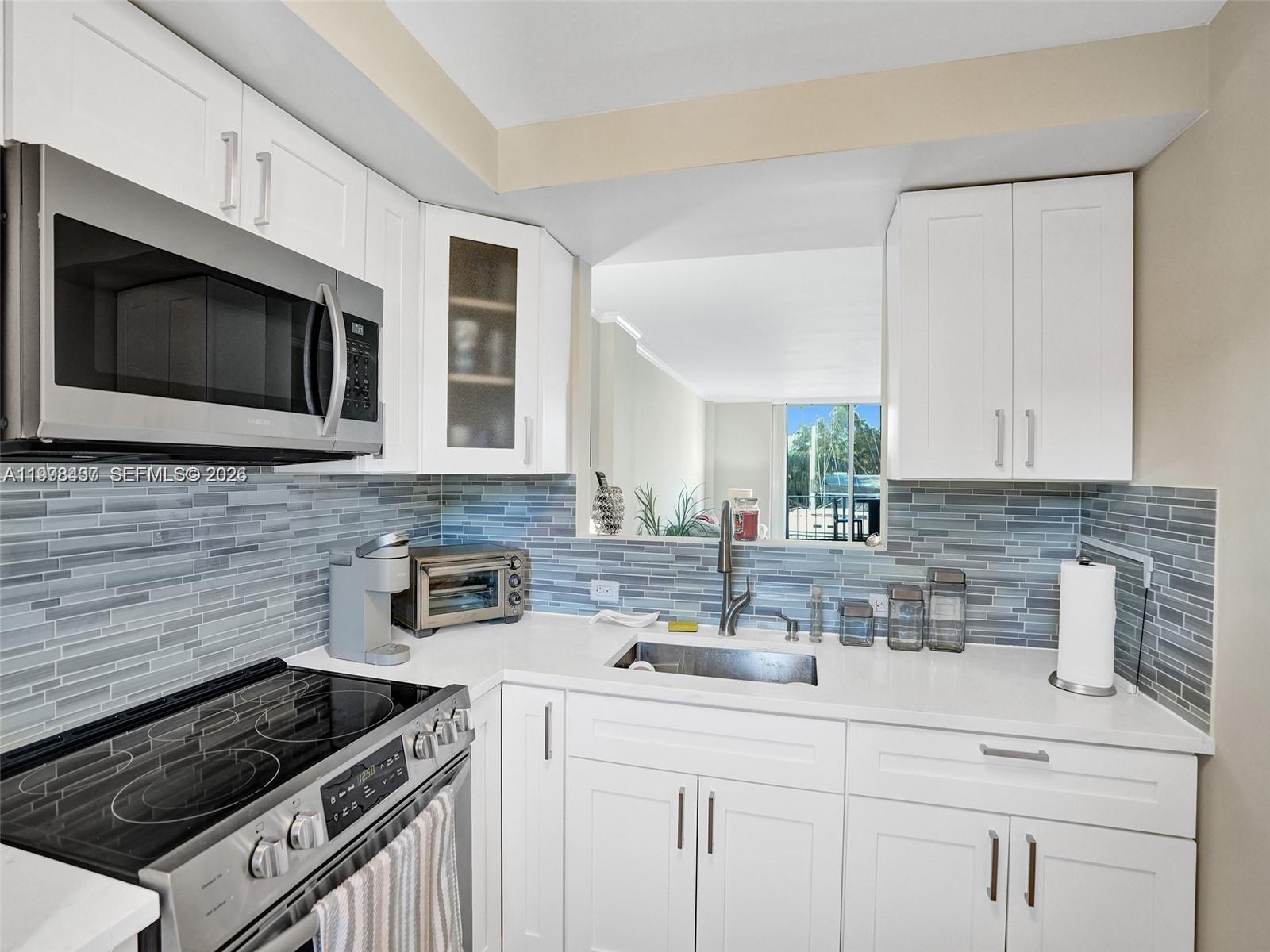 Fully renovated 2-bed, 1.5-bath condo right on the Intracoastal — marina views from your living room, balcony, and bedroom. Everything inside has been redone: new flooring, updated kitchen with stainless appliances, and finishes that actually feel elevated. Sliding doors open the living space straight onto the balcony, making indoor-outdoor living effortless.
Building pool overlooks the water. Minutes from Las Olas, the beach, and Fort Lauderdale's best dining.